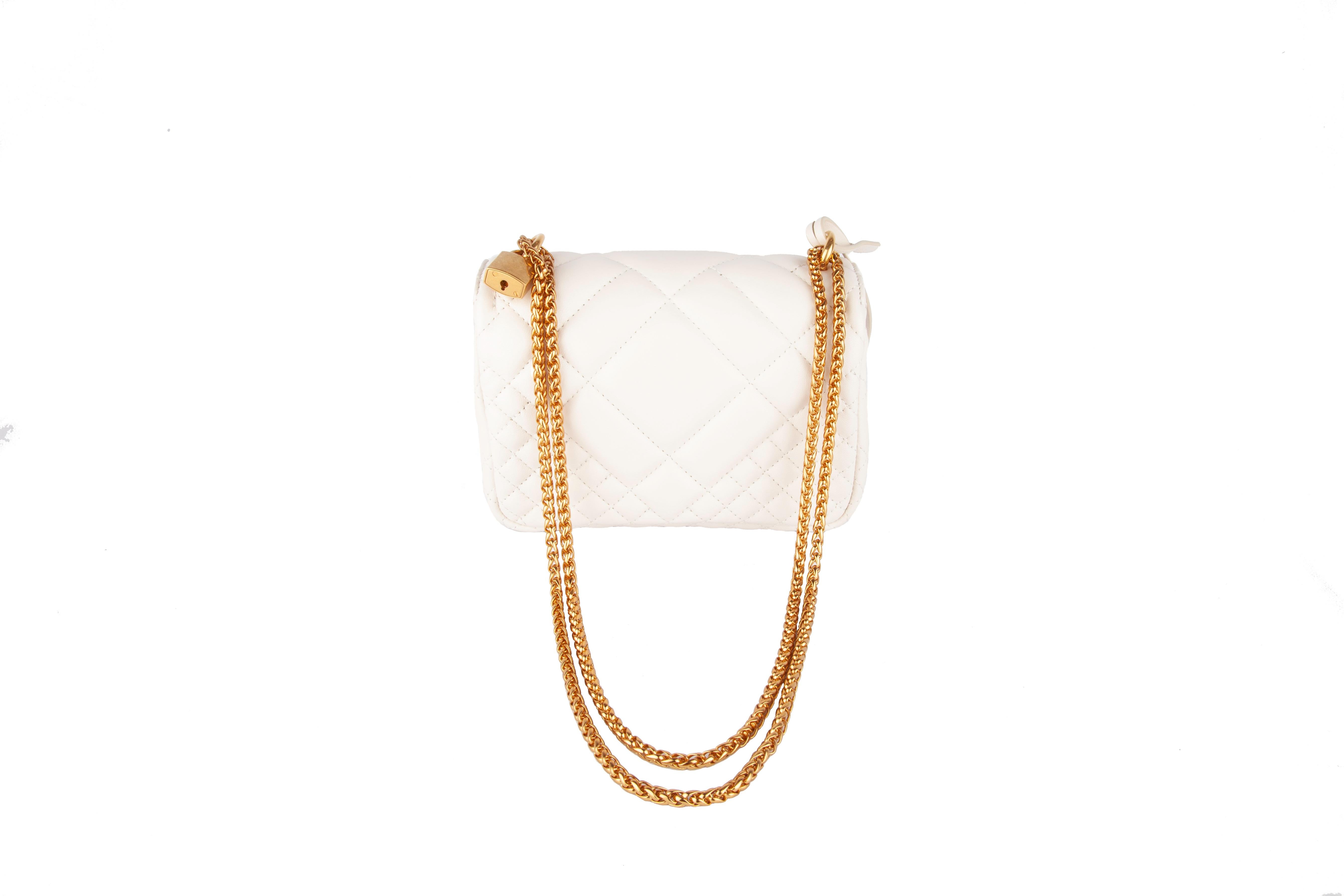 white quilted bag with gold chain