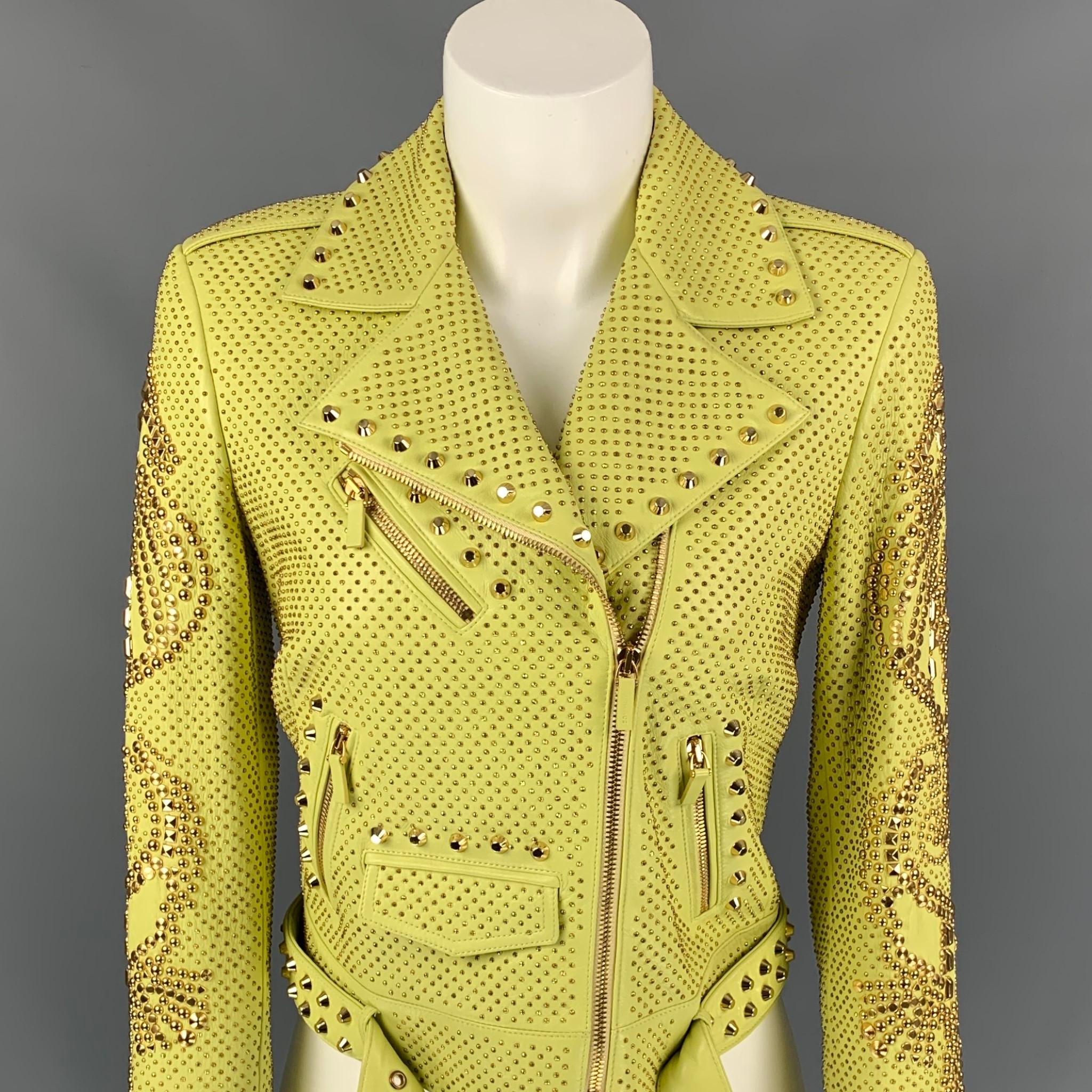 VERSACE Spring 2012 jacket comes in a luminescent yellow leather with a full monogram print liner featuring a biker style, gold tone studded details throughout, detachable epaulettes, zipper sleeves, belted, front pockets, gold tone hardware, and a