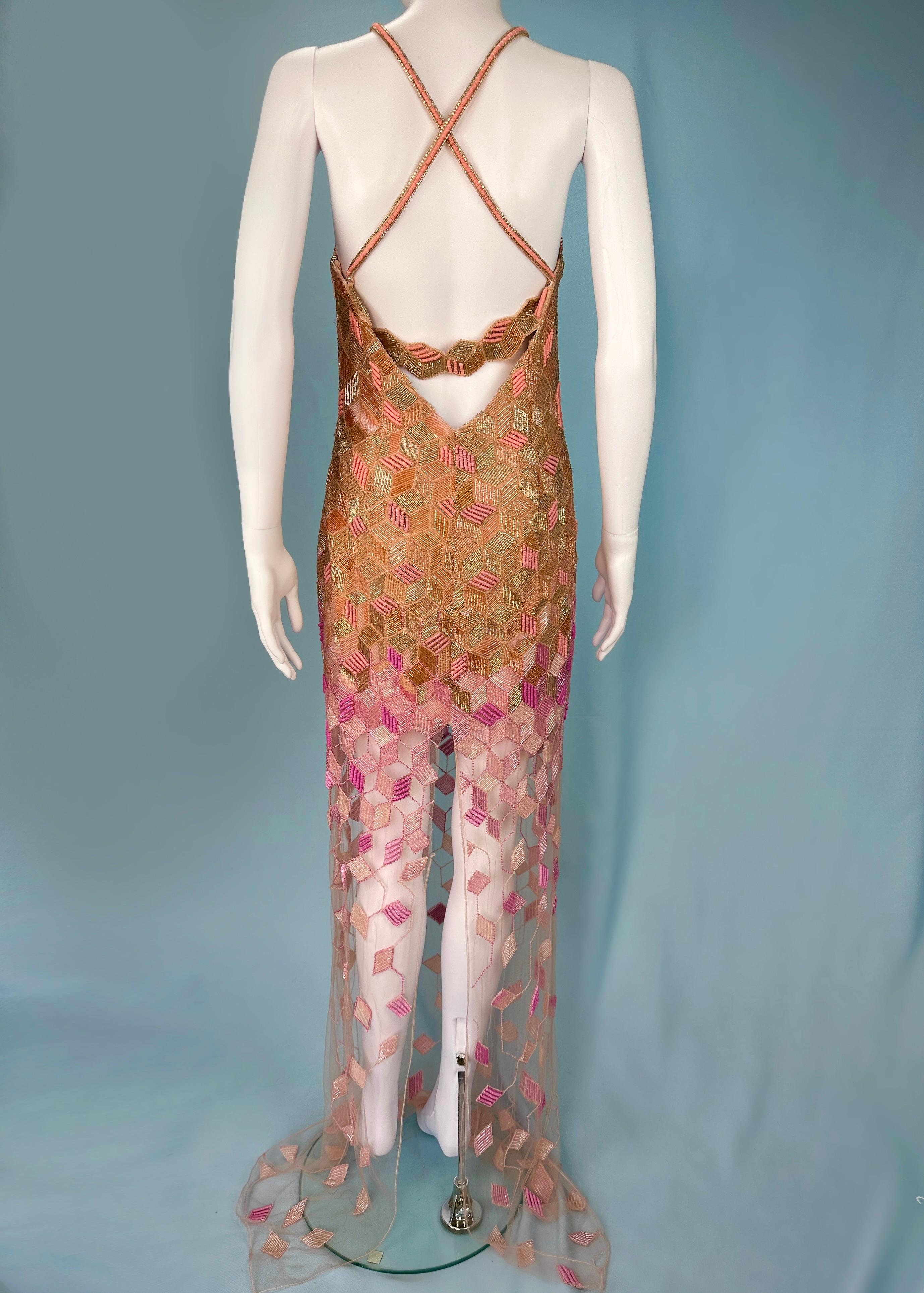 Versace
Spring 2015

Highly embellished full length gown
Geometric cube pattern
Ombre gold to pink
Mesh bust and lower skirt
Open back with embellished strap
Cross back straps
Plunge bust
Concealed zip up side

Size IT 42 / UK 10 / US