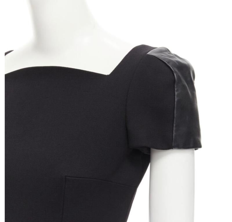 VERSACE square neckline leather cap sleeve bodycon seam sheath dress IT38 XS
Reference: KEDG/A00062
Brand: Versace
Designer: Donatella Versace
Material: Wool
Color: Black
Pattern: Solid
Closure: Zip
Extra Details: Curved square neckline. Leather