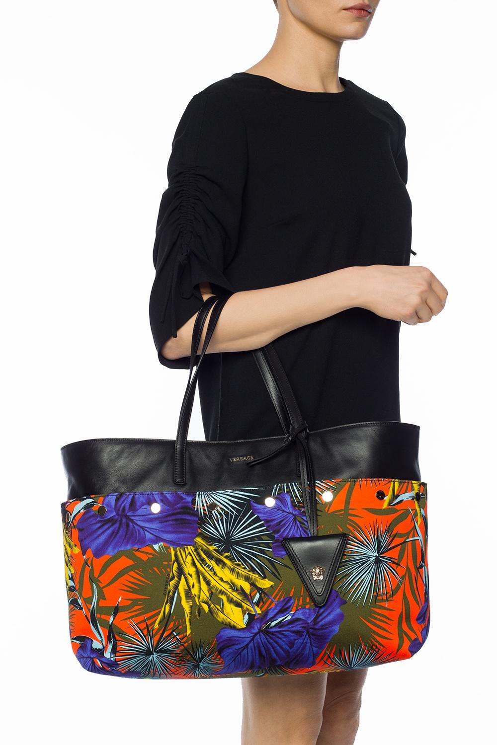 Versace SS18 Multicolor Desert Palm Shopping Tote Bag with Leather Straps

This vibrant colorful shopper bag from Versace is made of cotton and trimmed with leather. Decorated with metal studs, logo and 'Desert Palm' print. 2 semi-round handles with