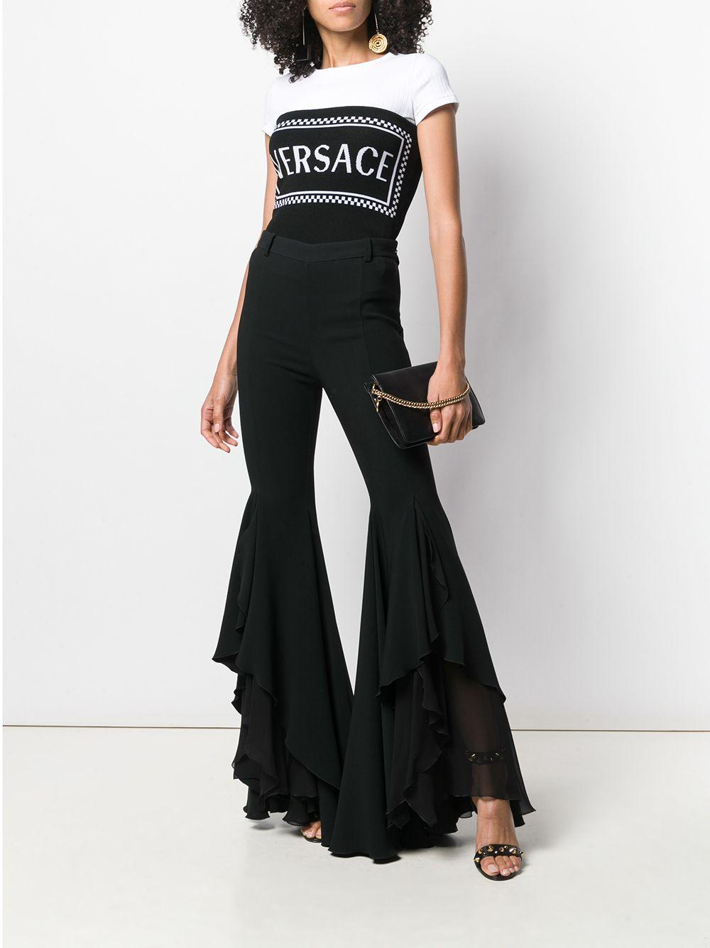 Versace SS19 Black Ruffled Hem Flare Pants / Trousers

Versace’s tailoring is the epitome of modern power dressing, with nipped-in waists and unique silhouettes setting a new high-glamour agenda. Suit up, ladies! These black silk ruffled hem flared