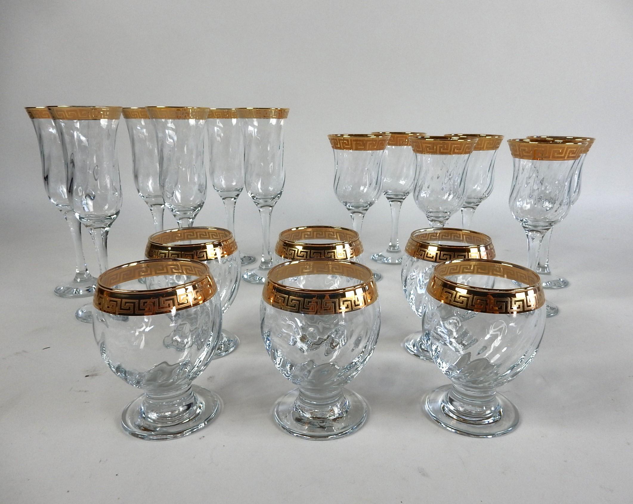 Gorgeous set of 18 bar glasses with
gold Greek Key design rims.
6 of each size, champagne, wine and rocks. 
Unbranded in the style of Versace.