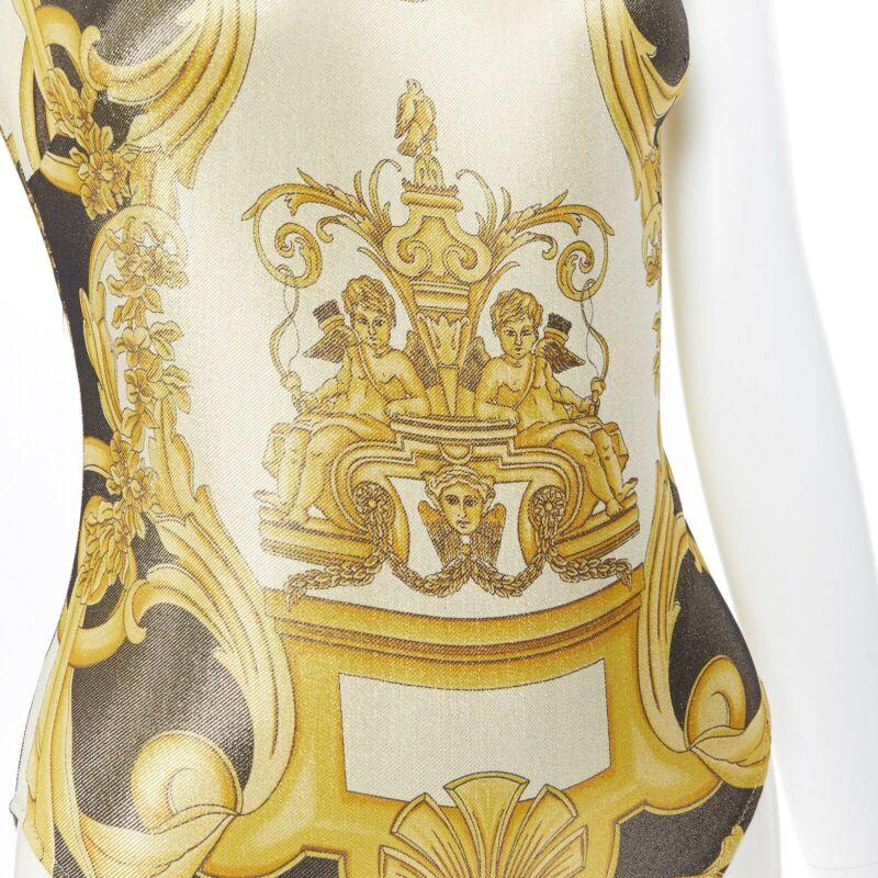 VERSACE Tribute SS18 Runway Baroque Cherub gold black lurex bodysuit IT38 XS
Reference: TGAS/A05342
Brand: Versace
Designer: Donatella Versace
Model: Bodysuit top
Collection: Spring Summer 2018 - Runway
Material: Polyamide, Blend
Color: Gold,