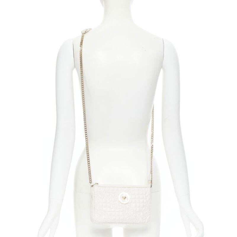 VERSACE Vanitas white baroque quilted gold Medusa metal chain crossbody bag
Reference: TGAS/B01474
Brand: Versace
Designer: Donatella Versace
Model: White Vanitas crossbody bag
Material: Leather
Color: White, Gold
Pattern: Solid
Closure: Zip
Lining: