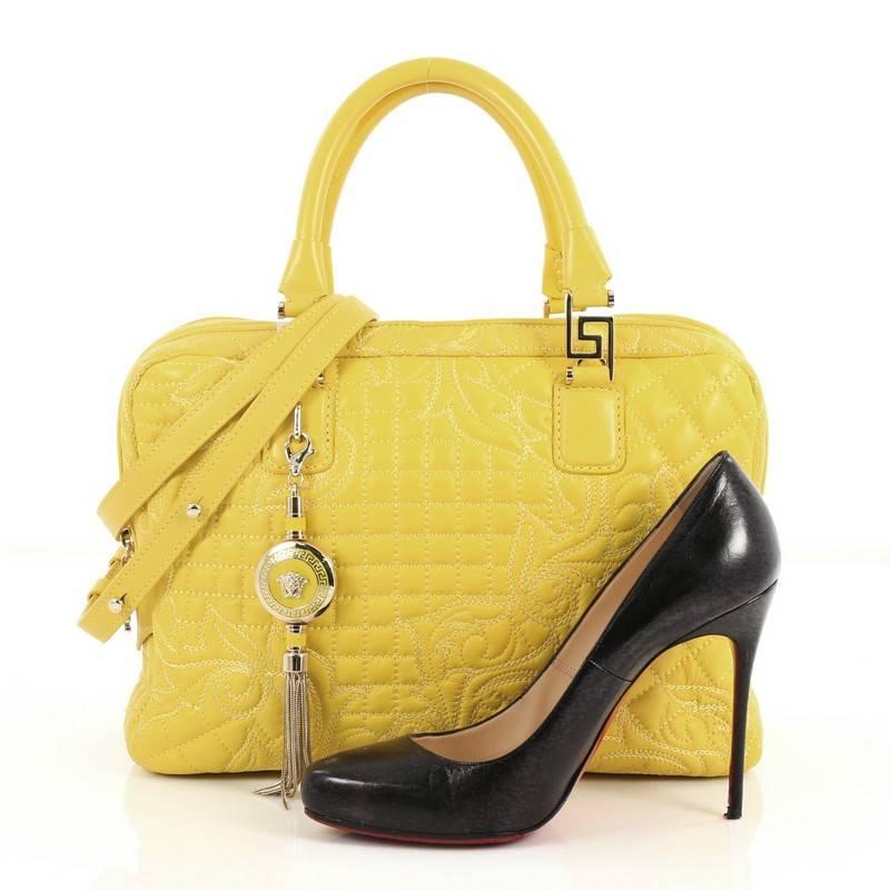 This authentic Versace Vanitas Zip Satchel Barocco Leather Large exudes classic Versace styling with a modern twist perfect for everyday use. Constructed from yellow barocco quilted leather, this bag features dual-rolled handles, enameled medusa