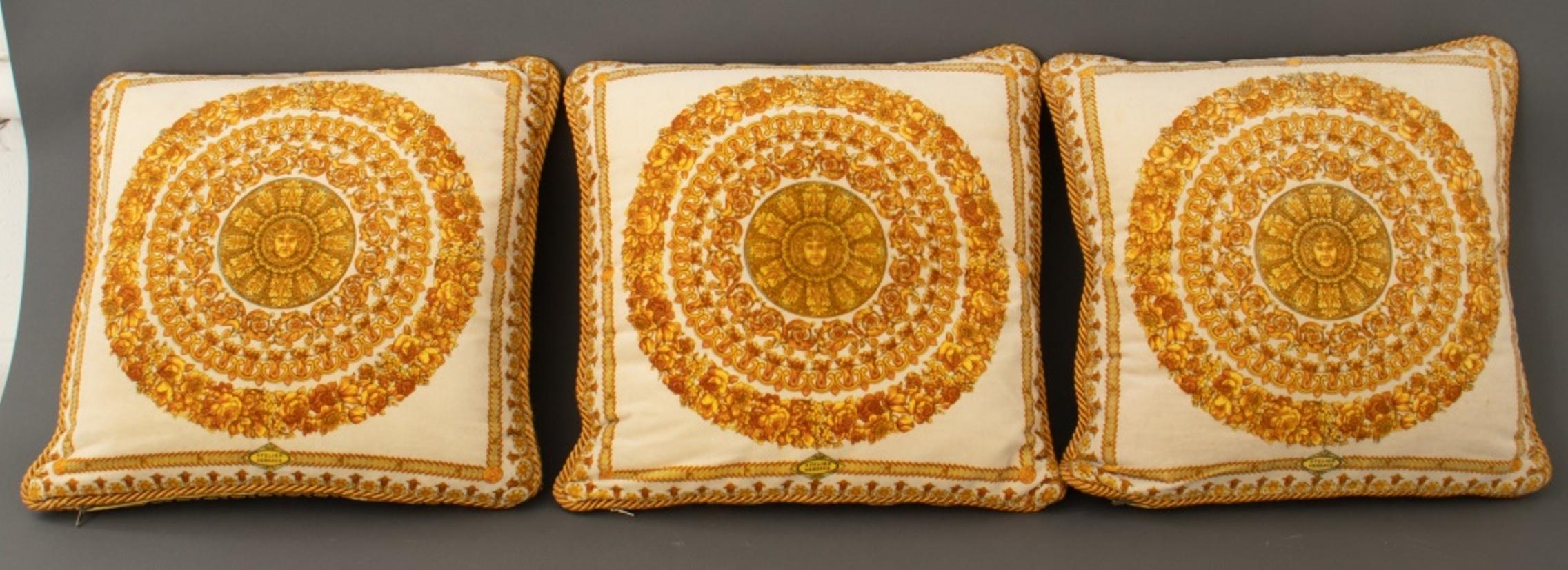Group of Versace velvet throw pillows, 3, each depicting the Medusa head motif and signed 