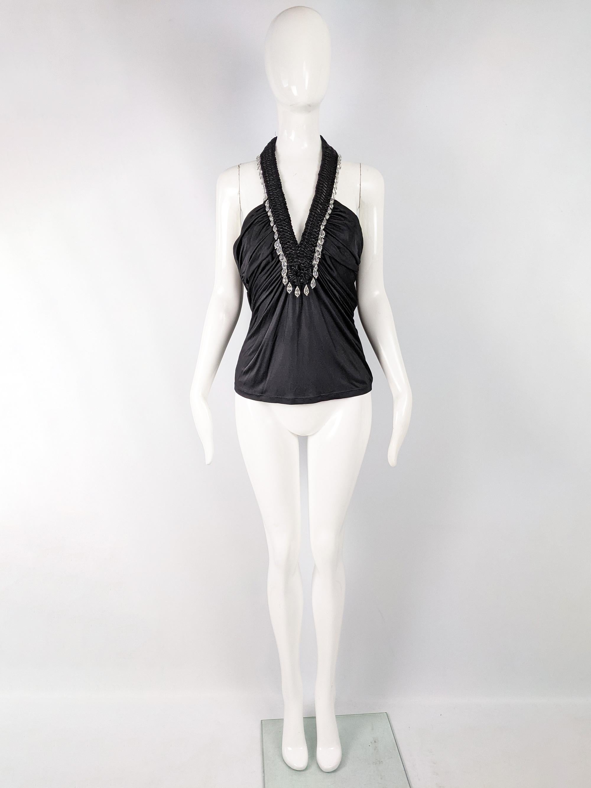 A stunning vintage womens mainline Versace top from the Spring Summer 2006 collection. It is made from a beautifully draped black jersey with a structured, braided halter neck trimmed with teardrop beads. Perfect for a party or evening event.