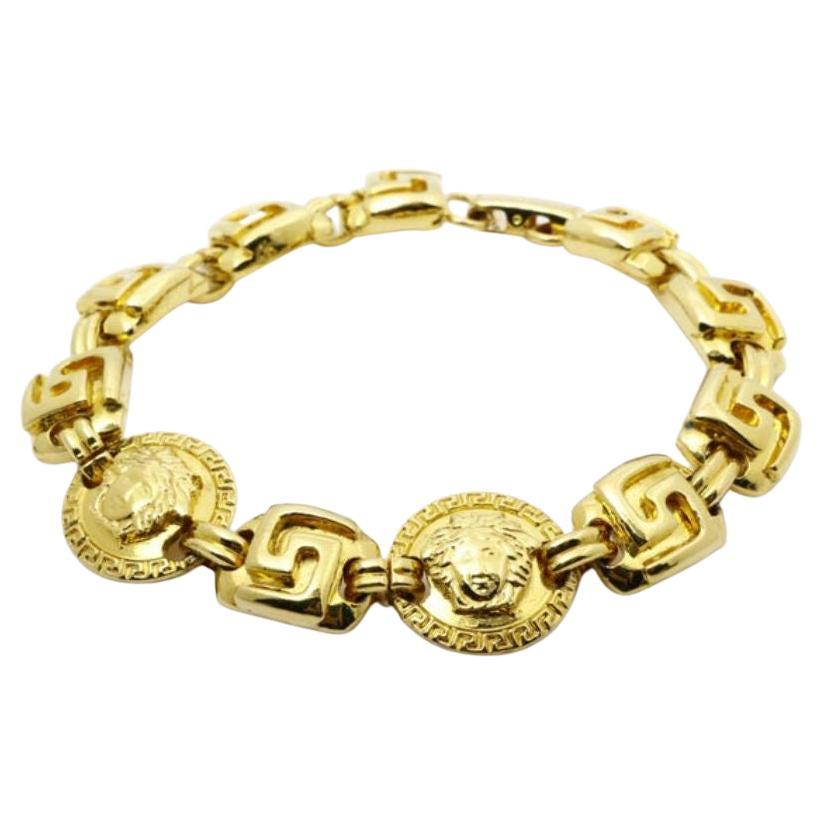 Versace Vintage Bracelet features chunky gold-tone hardware For Sale