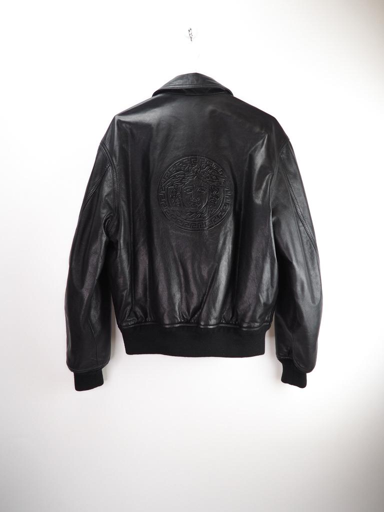 Versace Vintage Leather Jacket, big Medusa logo visible. Reversible, with two external pockets, zipped front. 

COLOR: Black 
MATERIAL: 100% leather, 100% polyamide 
SIZE: Small
CONDITION: Excellent condition, no evidence of wear.