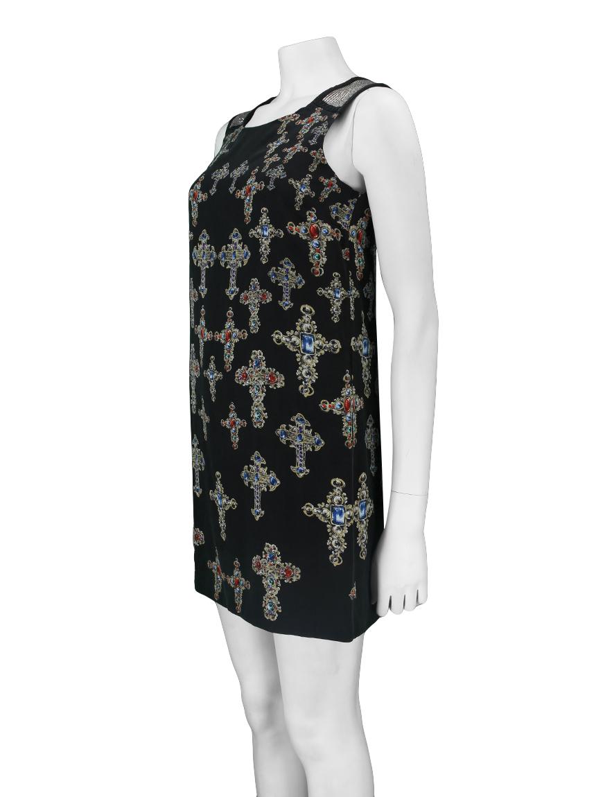 Versace Silk Dress
 Original print made of black silk fabric with ornate cross print. 
It has a straight shaping and thick handle with a silver metal mesh application.
Metal mesh inserts
Origin: Italy
Black color
Hardware Color: Silver

Size: IT 38