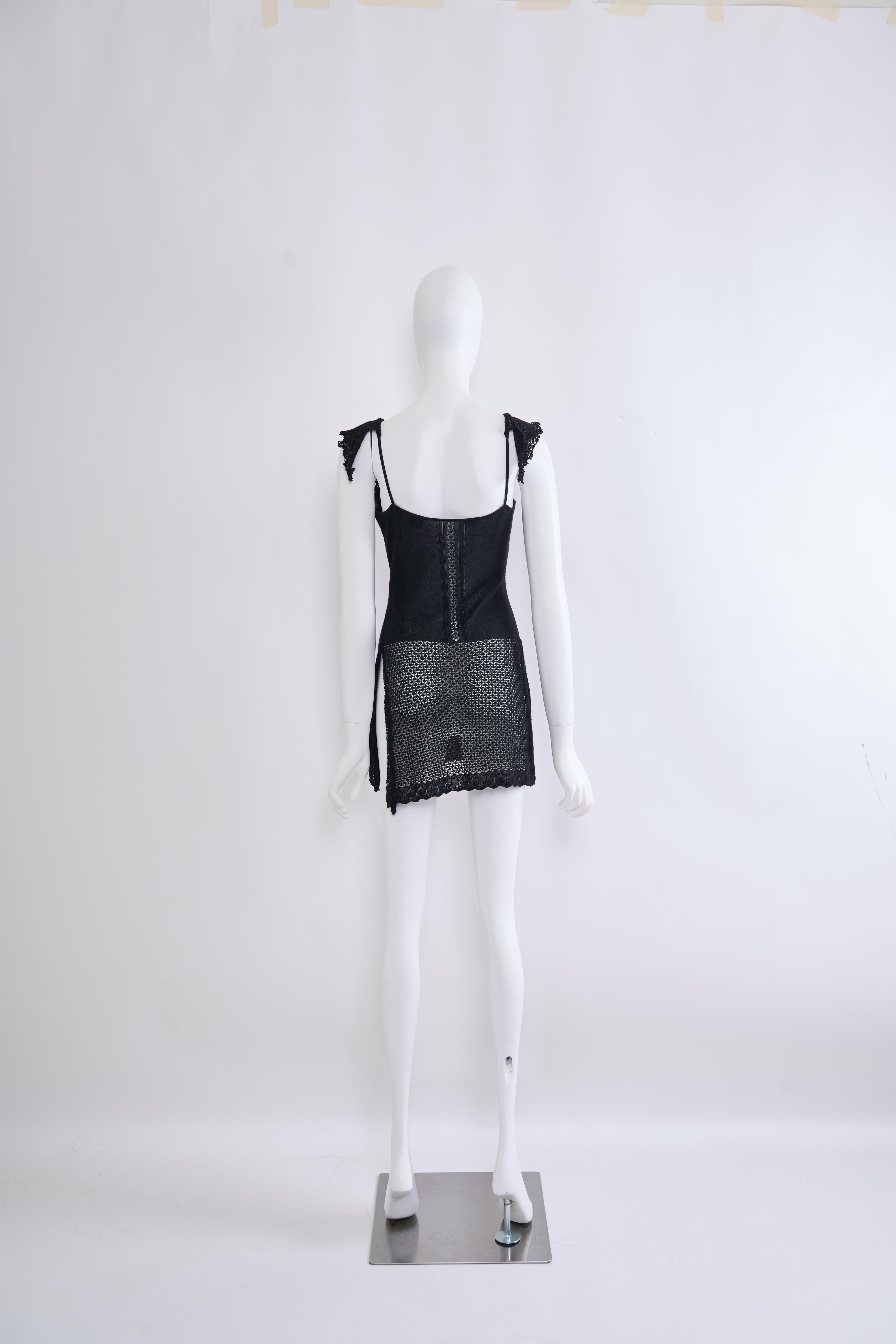 This vintage Versace tunic knit dress exudes a timeless and sophisticated style. The form-fitting silhouette with a sleeveless design creates a flattering and elegant look. The intricate knit pattern adds visual interest and a touch of texture to