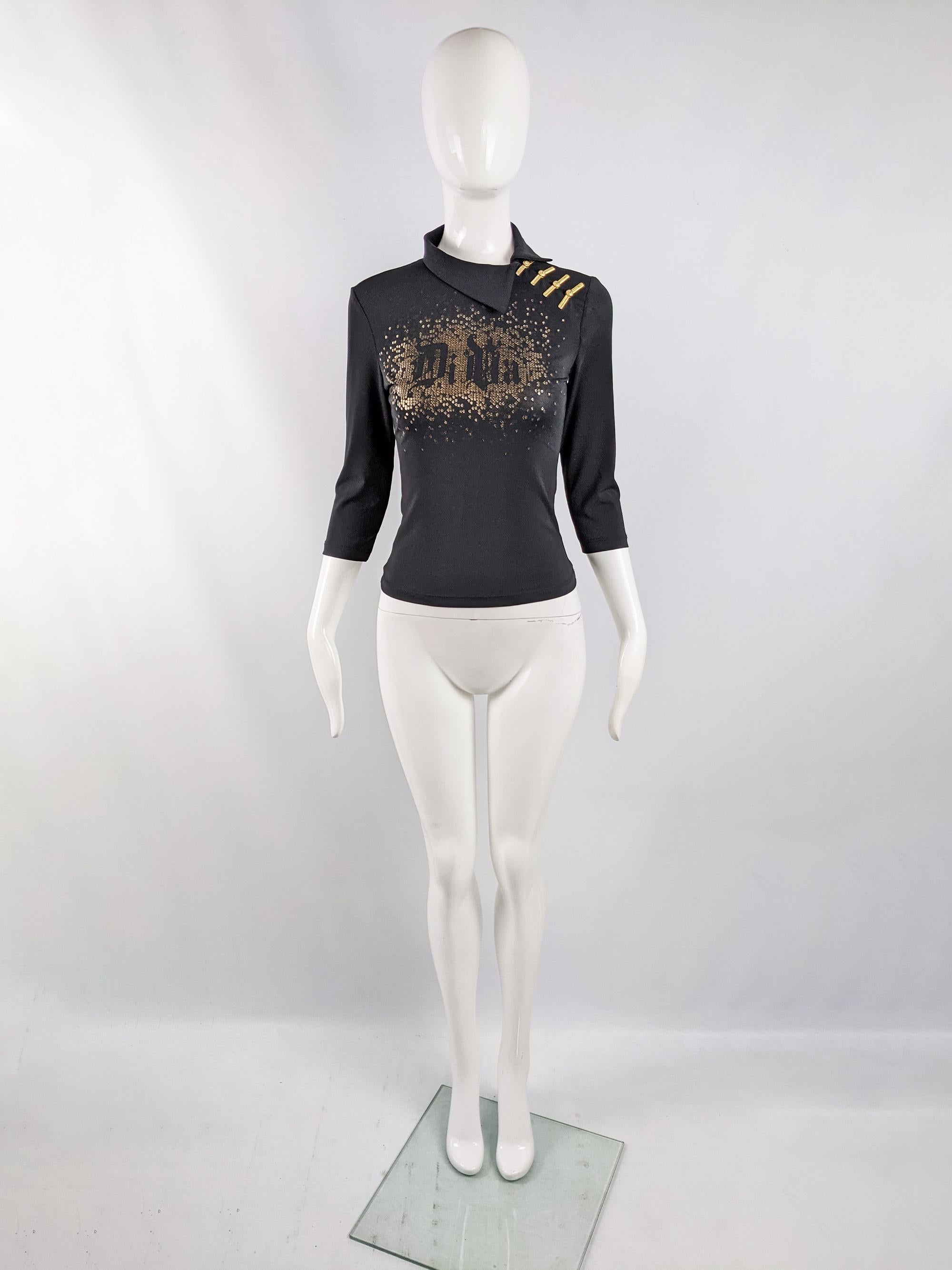 An incredible vintage Versace Jeans Couture womens top from the late 90s / early 2000s. Made in Italy, from a black jersey with half sleeves, asymmetrical collar and incredible gold clips on the shoulder giving an Asian inspired feel. The front is