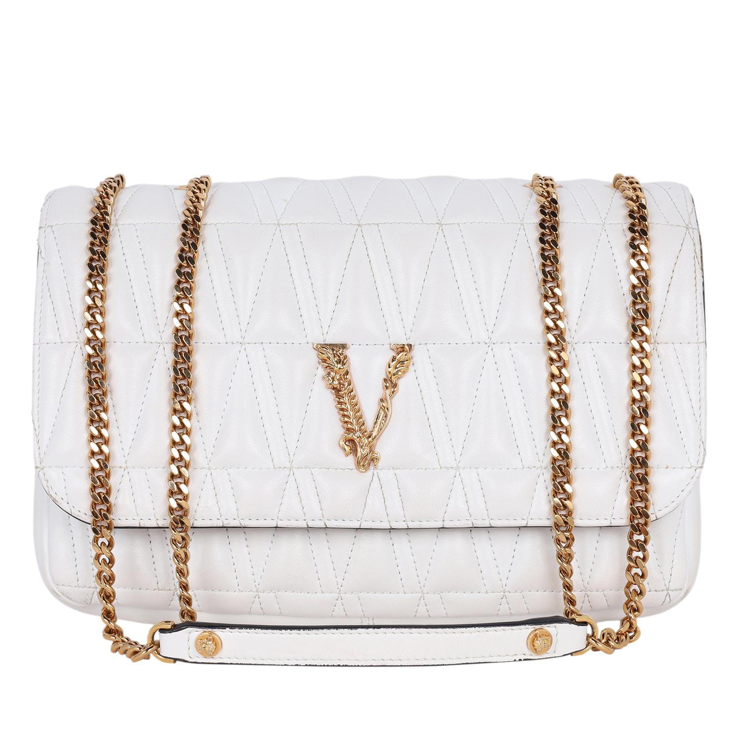 Authentic, pre-owned Versace Virtus Logo Plaque Quilted Shoulder Bag in white. Features quilted leather, front flap, Barocco V-ornament at the front, gold and leather strap, large interior with floral print, slip pocket and cc slots.

Strap 22