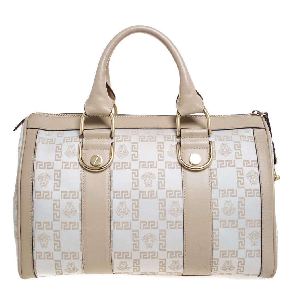 Made from monogram satin and leather, this bag is both reliable and stylish. It comes in a simple style with features such as two handles and a satin interior. This accessory from Versace will do justice to both style and comfort.

Includes: Info