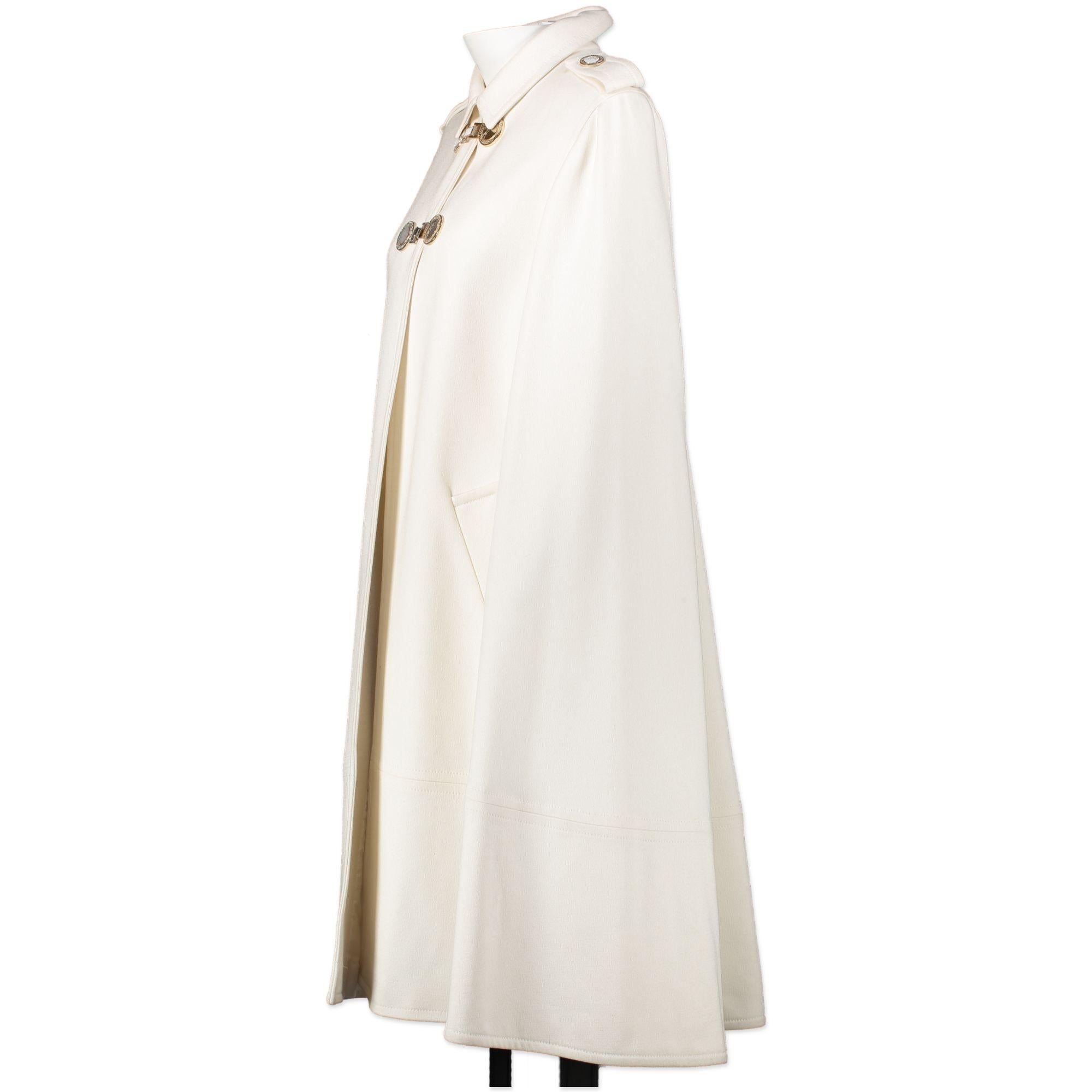 Good preloved condition 

Versace White Cape - IT44

If you want to make an electrifying statement, Versace has got you covered. A white cape that features gold-toned buttons that will give your outfit a cool and classic touch. 

The perfect coat
