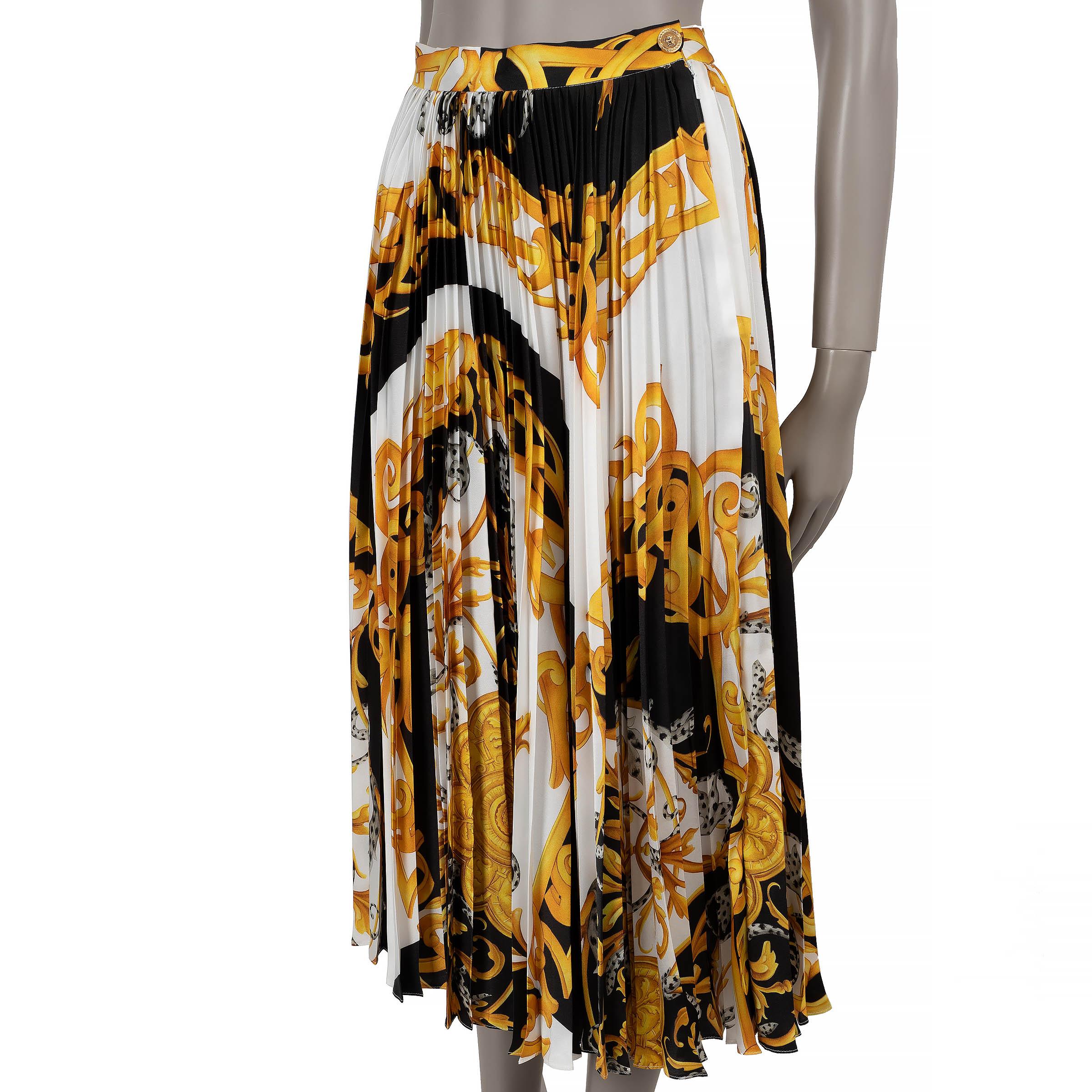 This 100% authentic Versace skirt in white polyester (100%) showcases the iconic Barocco Acanthus print in black and gold. Designed with a fully plissé pleated, flared silhouette, it features a midi length and high waist for a timelessly elegant