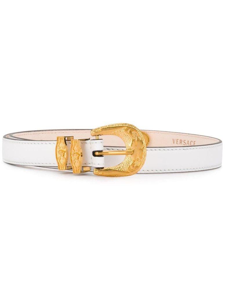 Versace White Leather and Gold Tone Baroque Buckle Belt

Slim leather Barocco belt from Versace featuring gold-tone hardware and stitch detailing. Style with high waist denim, a button down, and cowgirl boots for a subtle western vibe. Brand new.