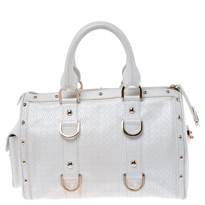 This white leather bag is the ideal pick for all your essentials. The satin lining of this bag is well-sized to house all your essentials. Made of superior quality, this studded Versace bag boasts of style and luxury.

Includes: The Luxury Closet