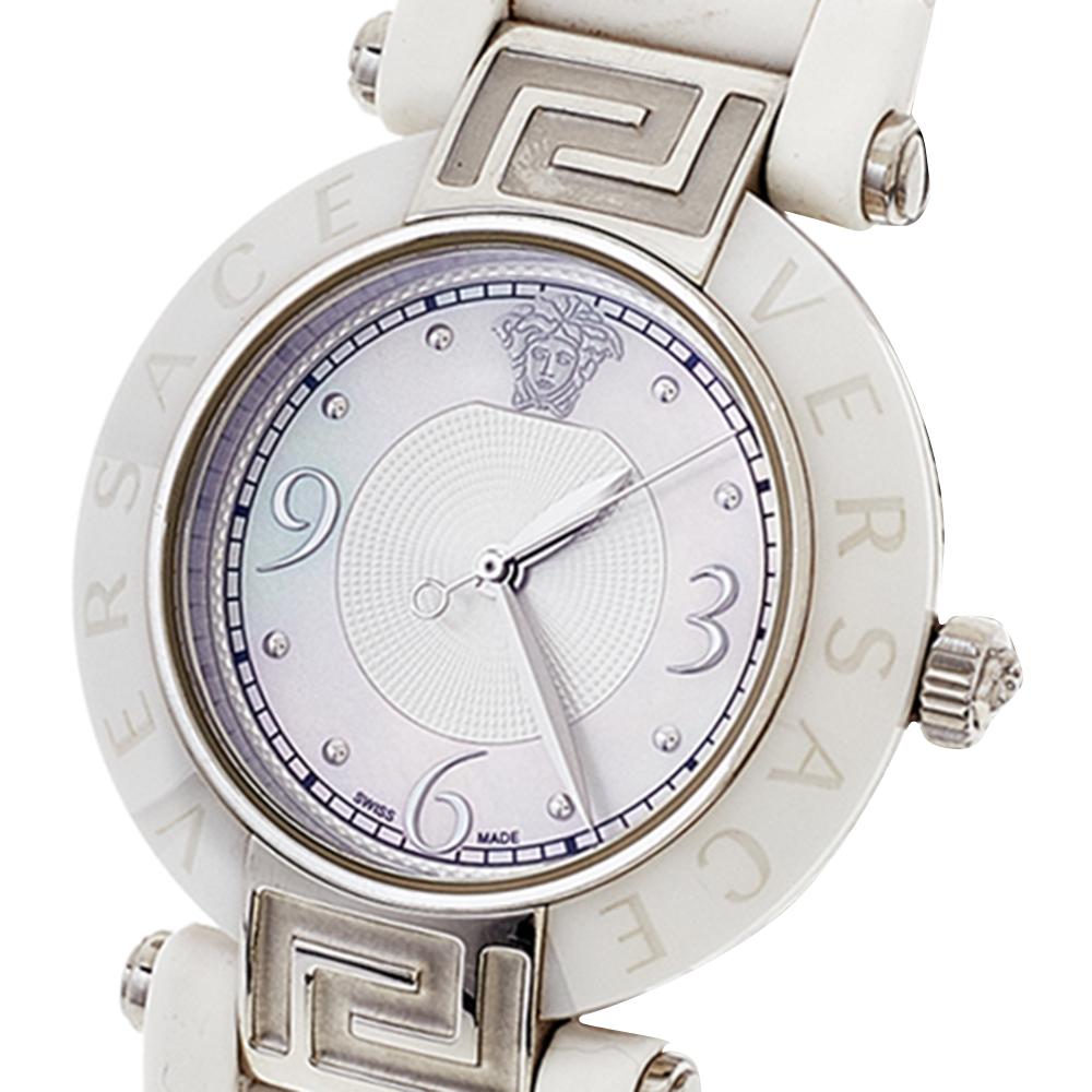 Crafted with beauty using white ceramic and stainless steel, the Quartz watch by Versace is held by rubber straps. It brings a Mother of Pearl dial set with Arabic numeral and dot hour markers and the Medusa logo at the 12 o'clock position. Complete