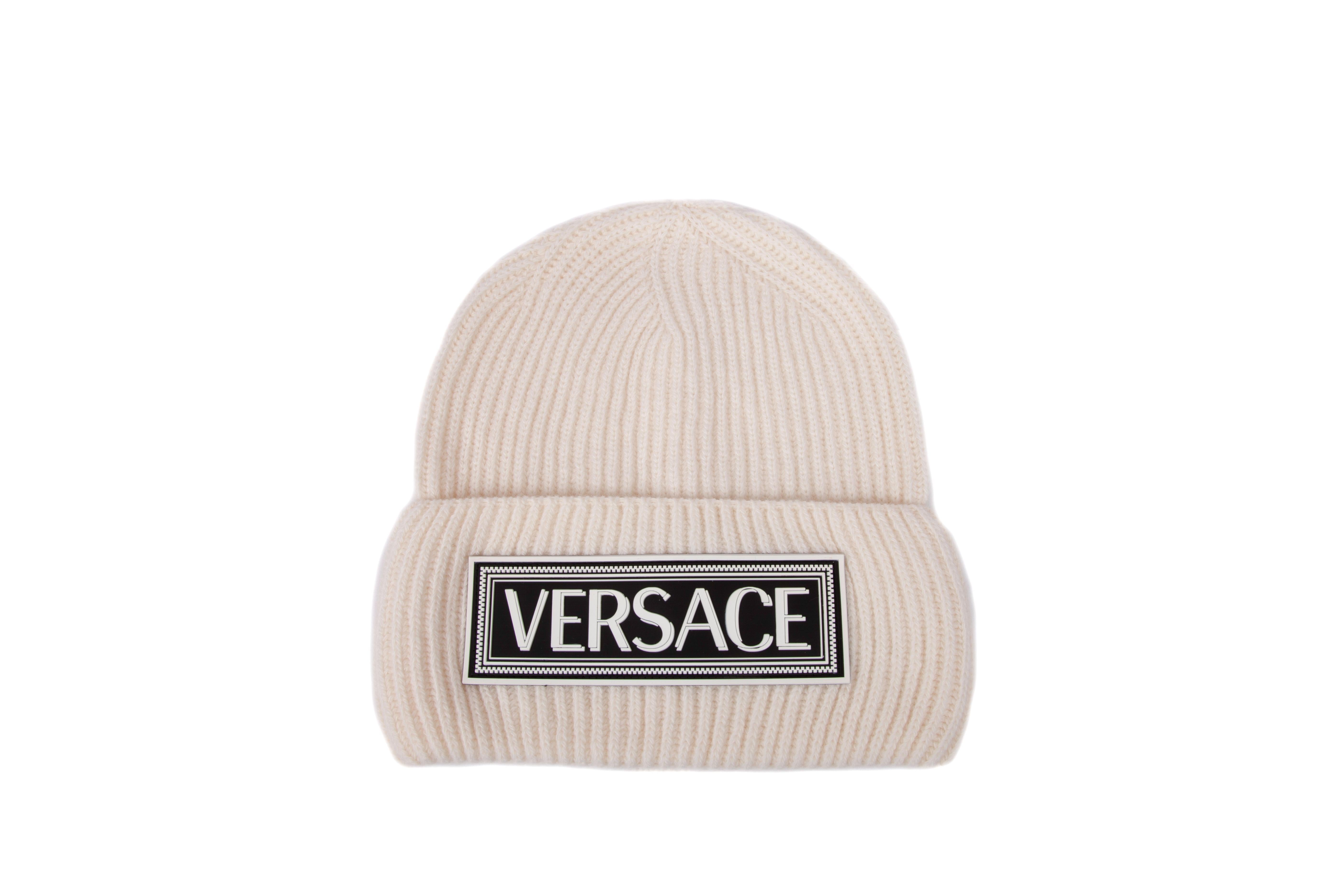 Versace White Wool Beanie Hat with 90s Vintage Logo

This Versace beanie features off-white knit fabric and the famous 90s vintage logo. Brand new with tags. Made in Italy.