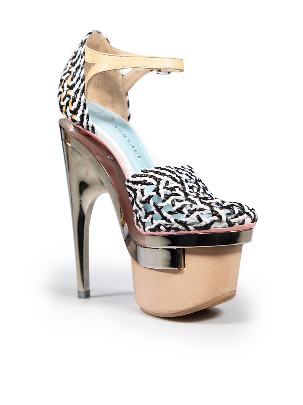 CONDITION is Good. Minor wear to the heels is evident. Small abrasions to the front and back of both shoes. Slight scratches to the front soles and overall metal. Light discolouration to the left side of both shoes and the back of the left shoe on