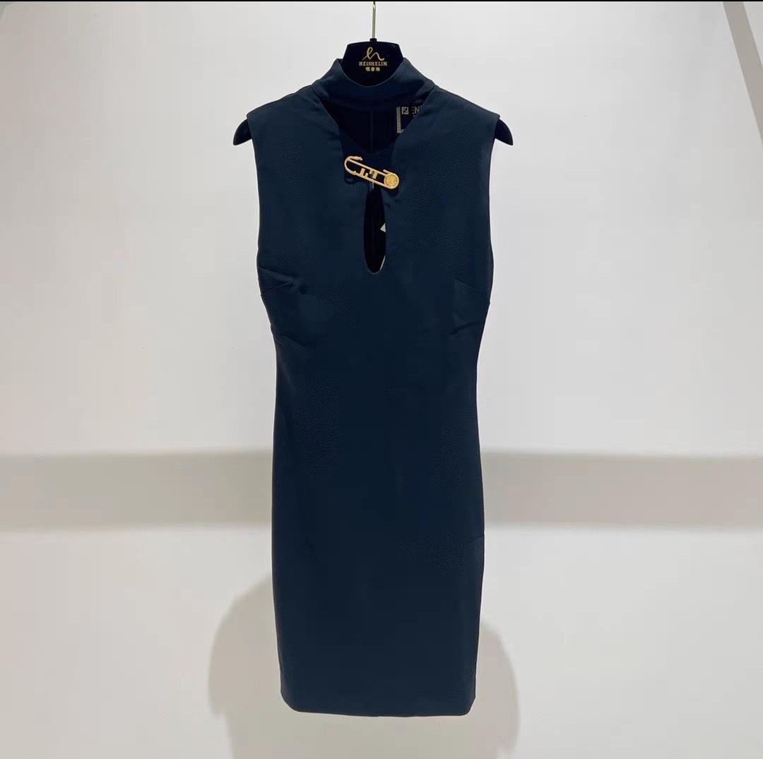 As seen on Kate Moss, Introducing the extraordinary collaboration between Versace and Fendi, the Versace X Fendi Fendace Black Keyhole Cut Out Safety Pin Dress in size 38. This captivating dress combines the distinctive aesthetics of both iconic