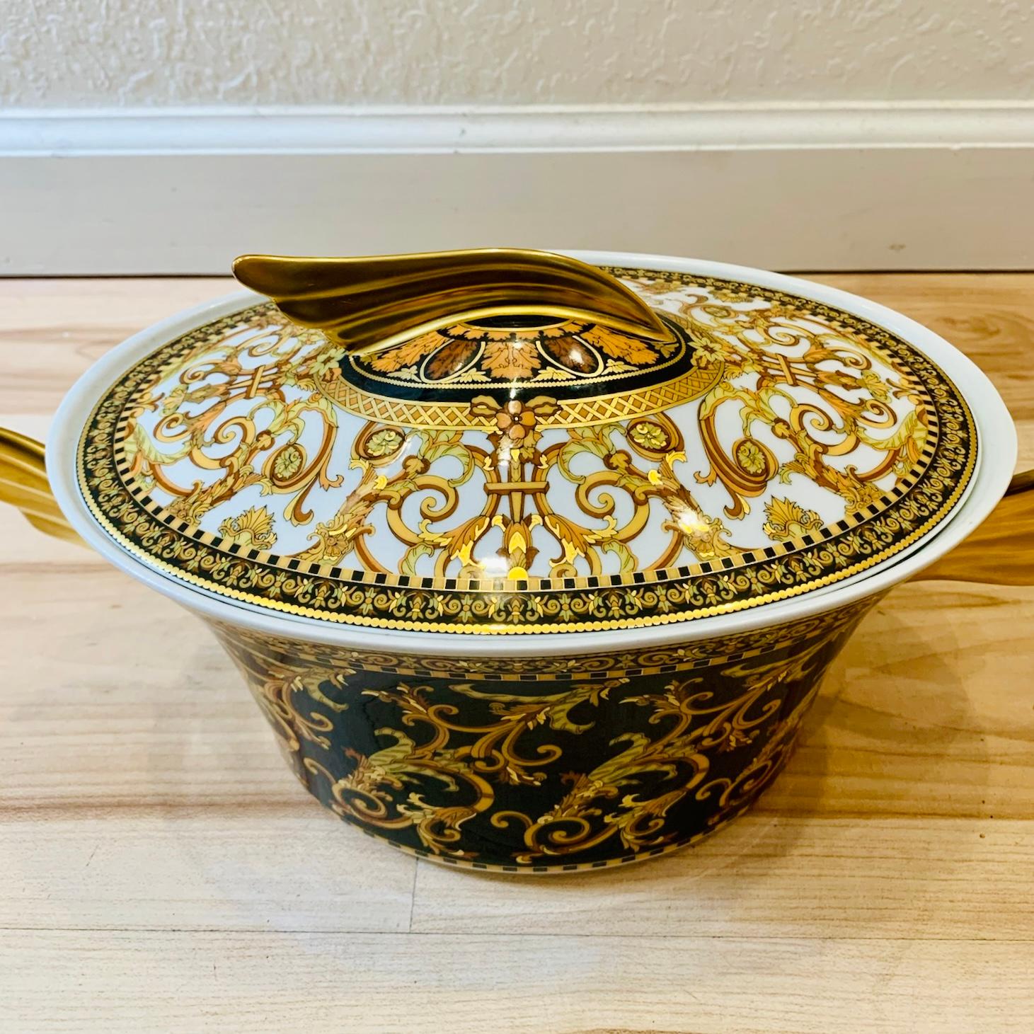 Versace x Rosenthal covered vegetable dish from the collaboration’s Barocco line. This piece features the iconic Barocco motif, a symbol of Versace's renowned extravagance. Crafted in collaboration with Rosenthal, known for its exceptional quality,