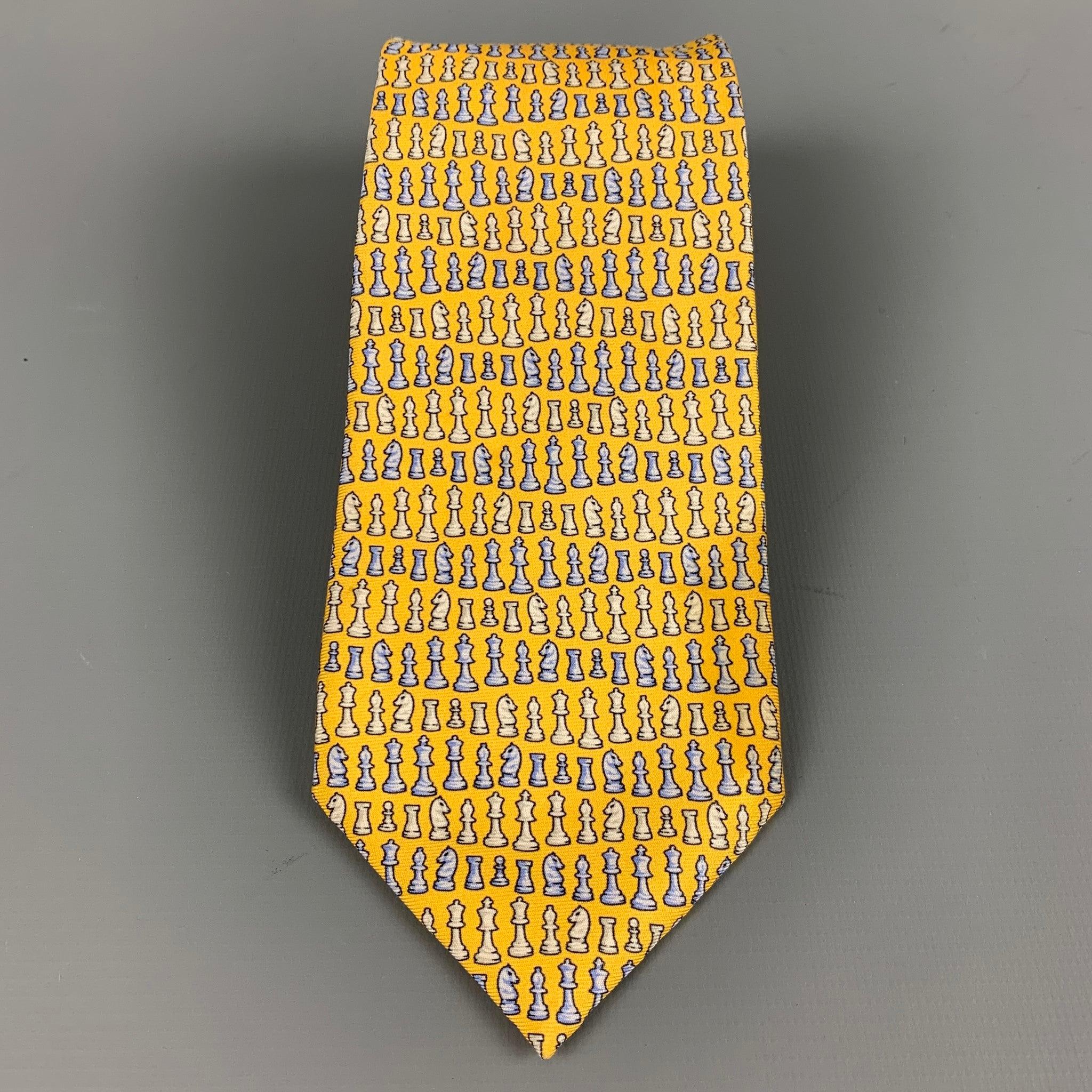 VERSACE
necktie in a yellow silk fabric featuring blue and white chess pieces. Made in Italy.Very Good Pre-Owned Condition. Minor signs of wear. 

Measurements: 
  Width: 3 inches Length: 61 inches 
  
  
 
Reference: 127312
Category: Tie
More