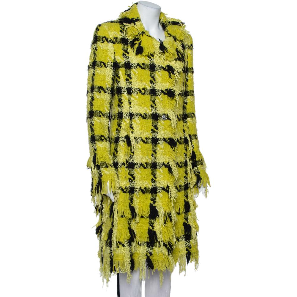 For the most sartorially elegant women, this Versace coat is imbued with chic details that make it high on style and fashion. Made from tweed fabric, this yellow-colored, checkered coat makes for a coveted choice for those chilly evenings. Team it