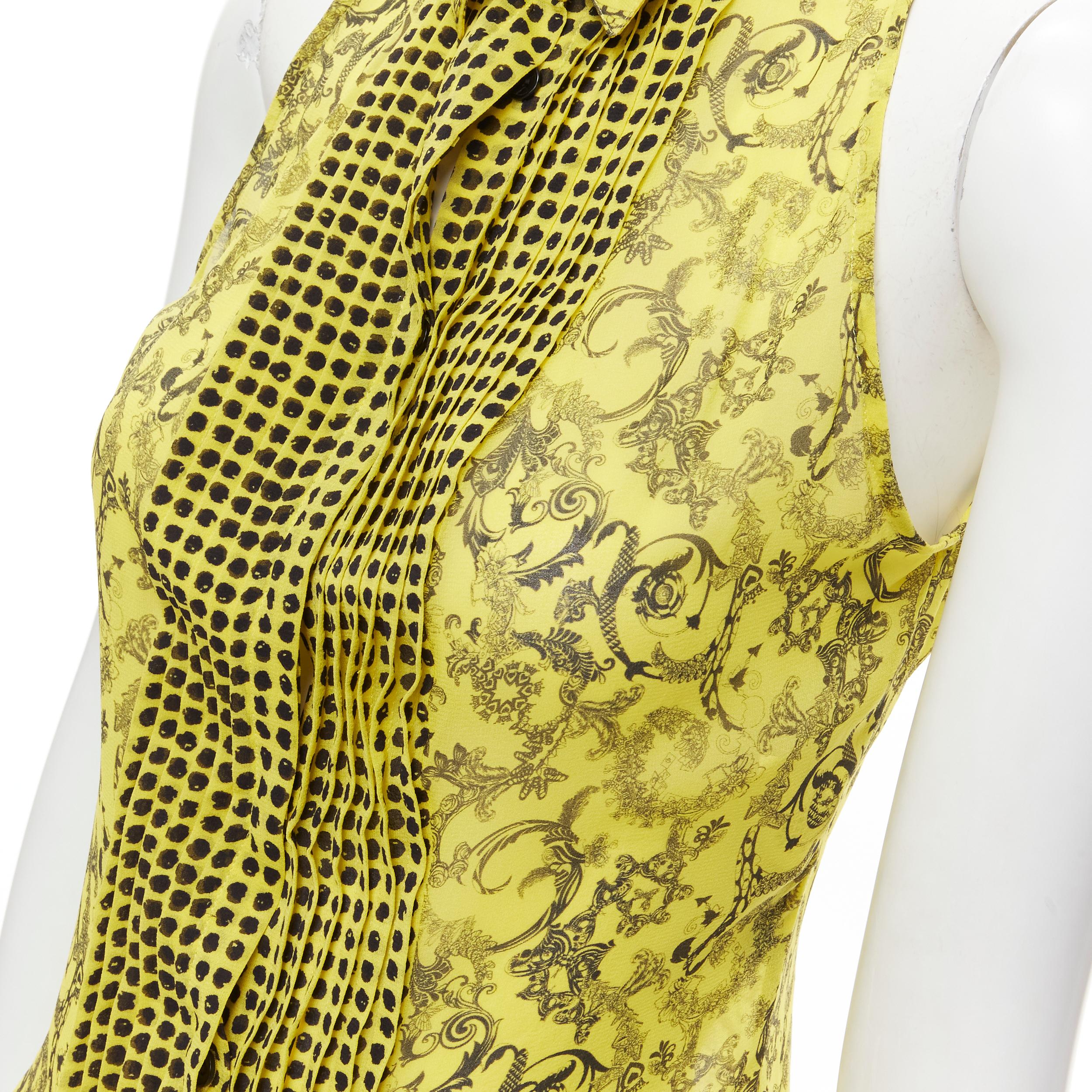 VERSACE yellow silk Baroque print polka dot pleated collar sleeveless shirt IT40 S 
Reference: DNCU/A00004 
Brand: Versace 
Material: Silk 
Color: Yellow 
Pattern: Baroque 
Closure: Button 
Made in: Italy 

CONDITION: 
Condition: Excellent, this