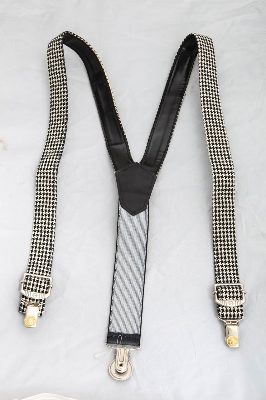 Very rare Young Versace rare suspenders with black/white Medusa motifs.
Youth size L, adjustable up to 32 inches.