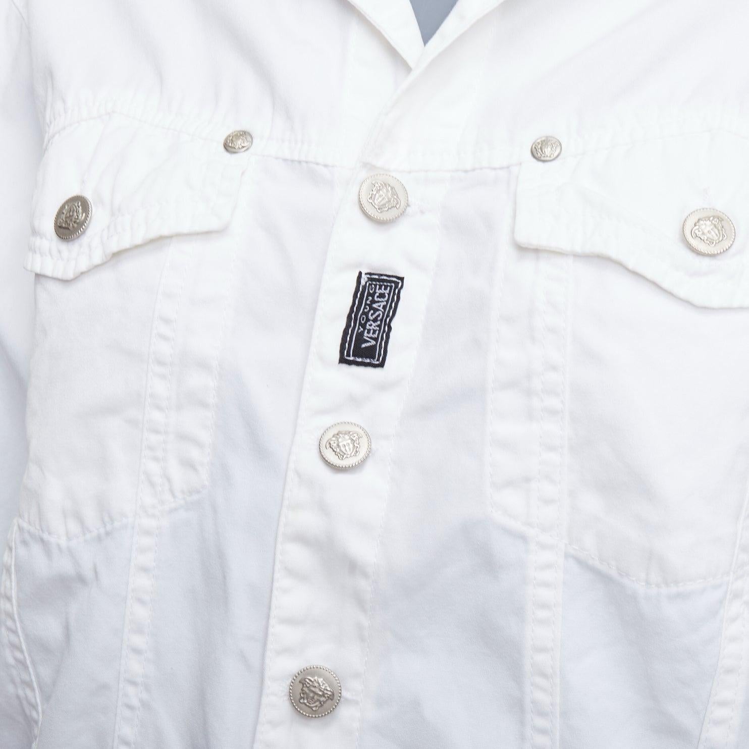 VERSACE YOUNG Vintage white silver medusa logo button jacket
Reference: CNPG/A00092
Brand: Versace
Collection: YOUNG
Material: Fabric
Color: White, Silver
Pattern: Solid
Closure: Button
Extra Details: Medusa logo buttons.

CONDITION:
Condition: