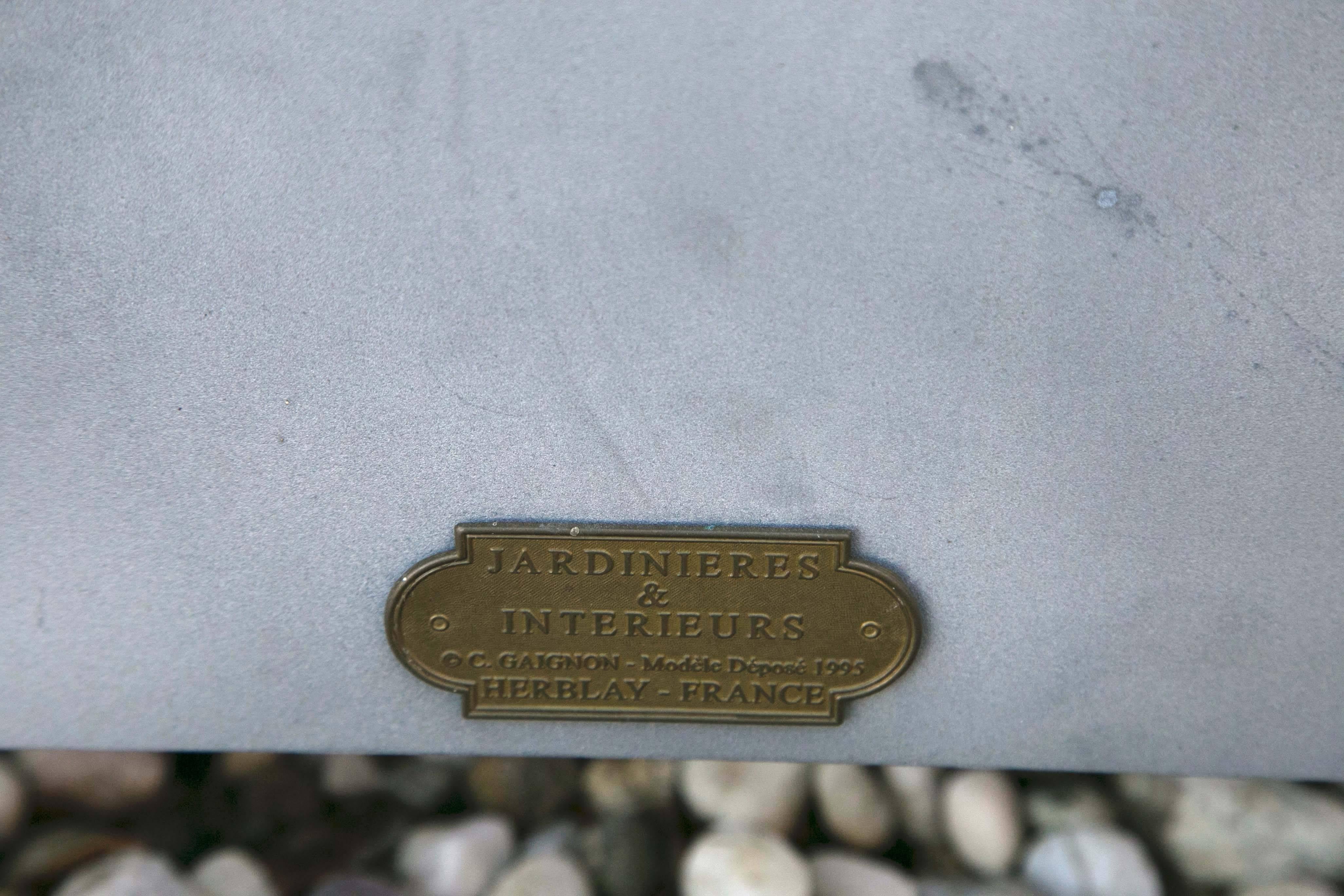 Iron posts and steel side walls - Plaque reads 