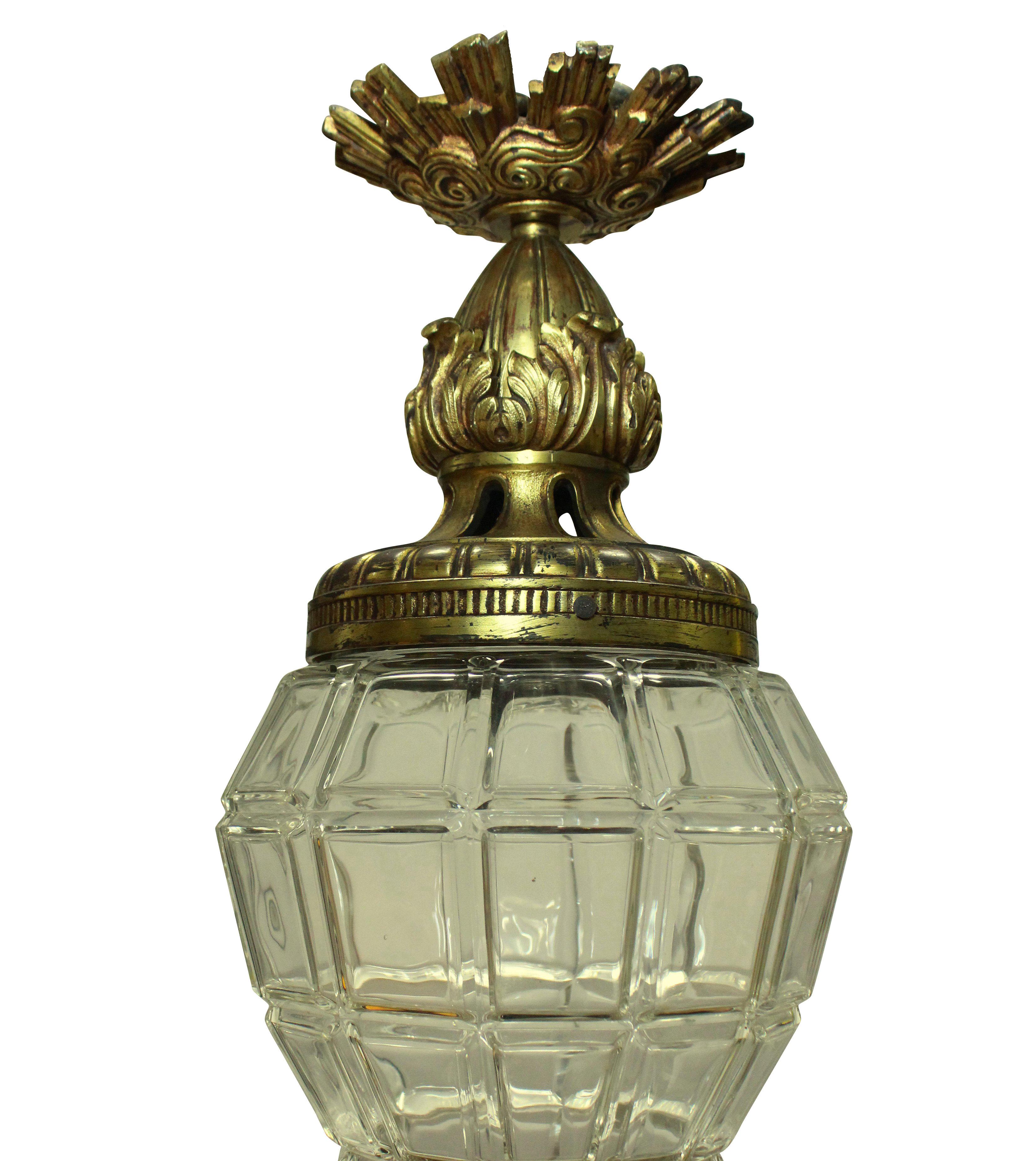 A French gilt bronze and glass lantern, modelled on the lanterns at Versaille, the canopy having sun rays.