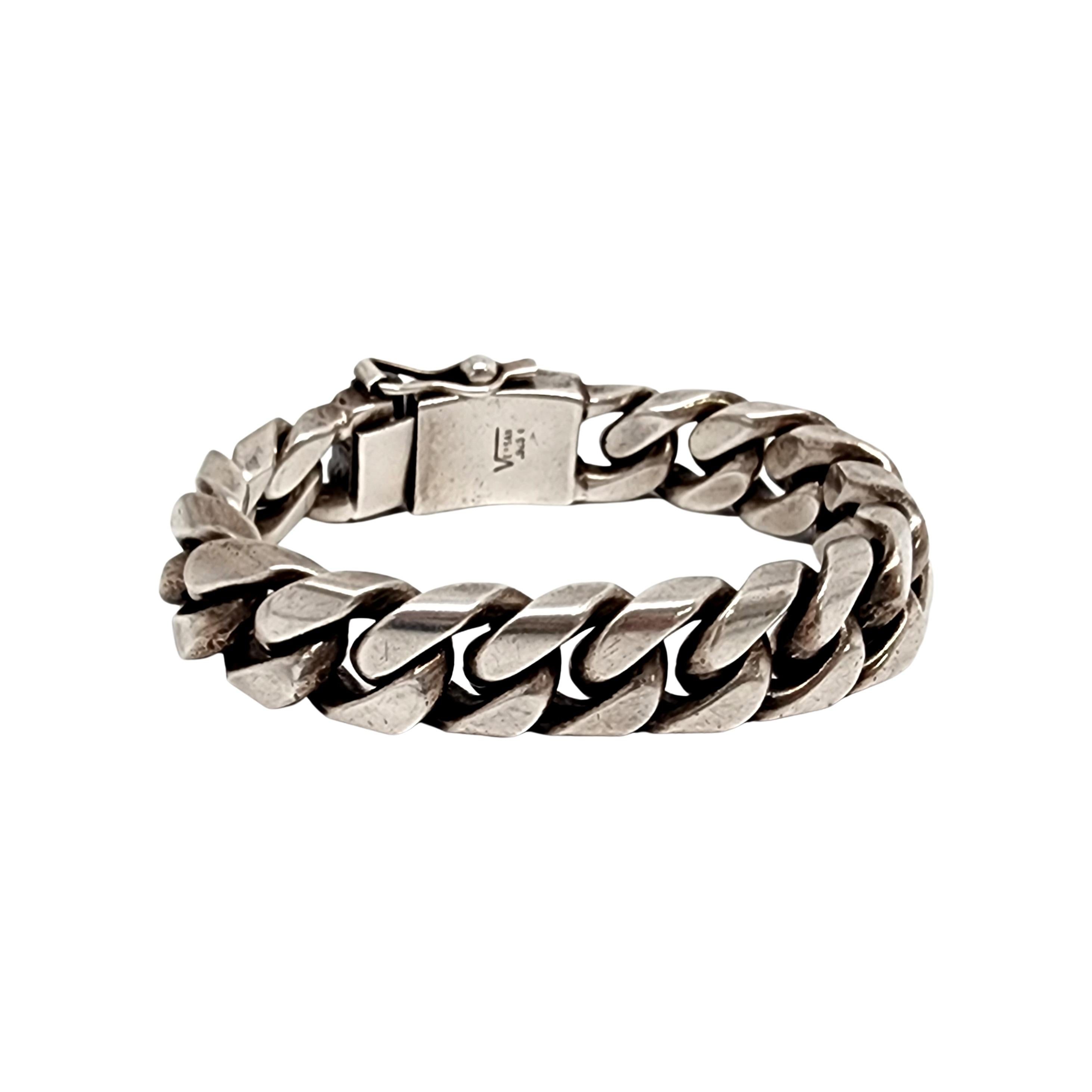Heavy, thick sterling silver Cuban link bracelet with crown by Versani.

A bold and substantial piece, this Versani bracelet features wide Cuban links and an applied crown on its slide closure with figure 8 safety clasp.

Measures approx 8 3/4