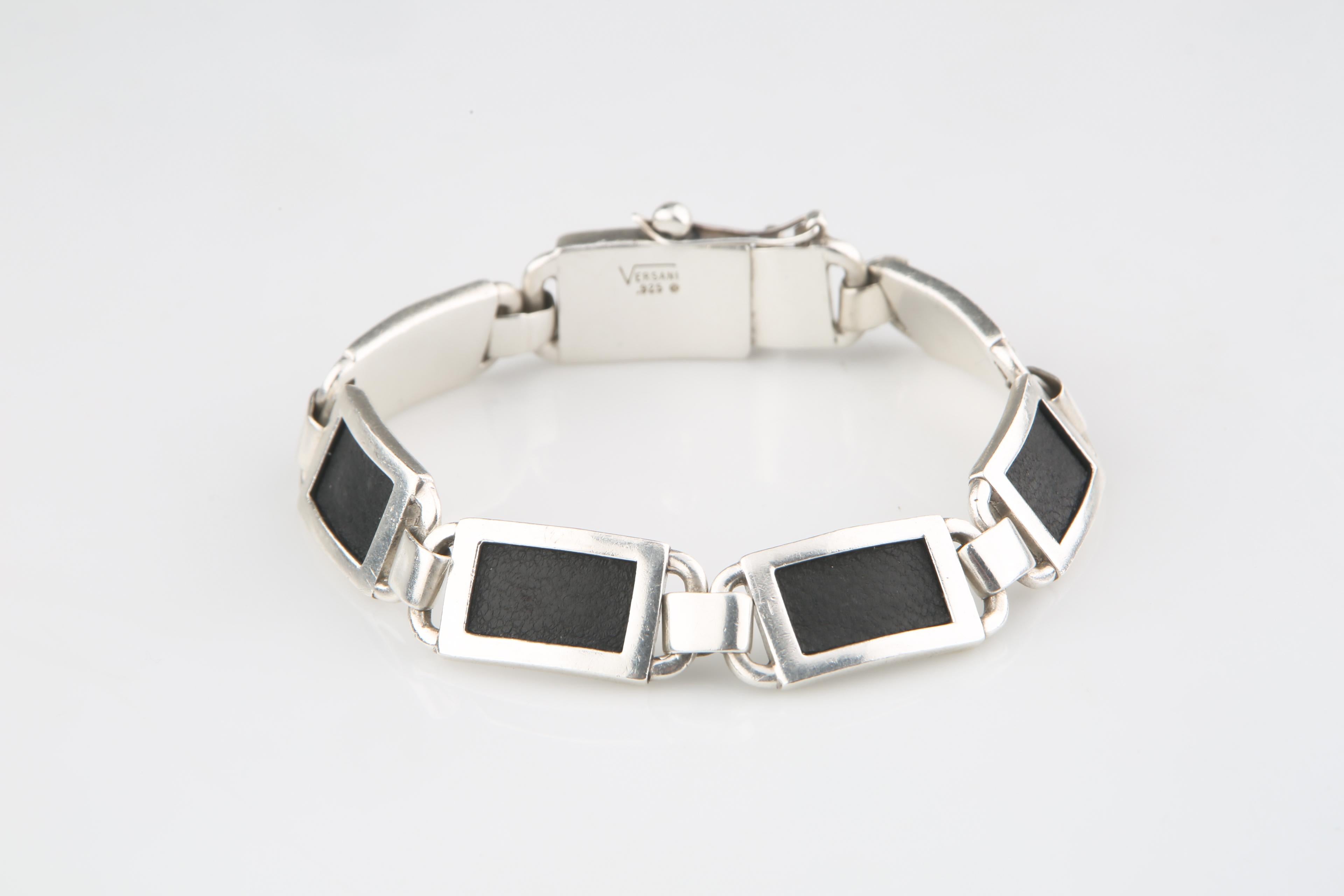 Rugged sterling silver plaque bracelet featuring swatches of stingray leather.
Total Length: 8.5 inches.
Width: 13 mm.
Total Mass: 53.5 grams.
Retails for $695 in the Versani Store.
A great deal!