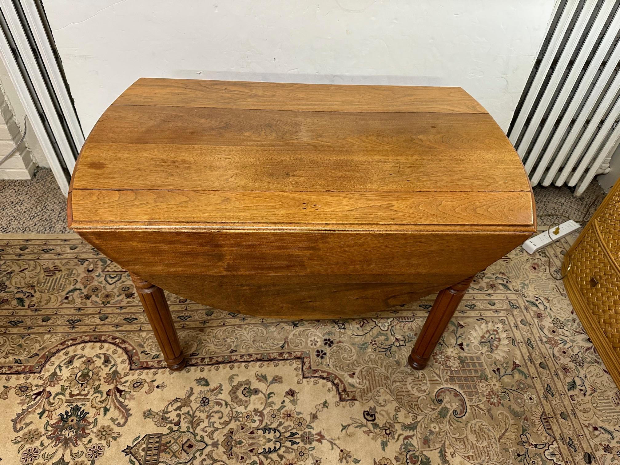 Versatile Antique Walnut Oval Drop Leaf Dining Table  For Sale 1