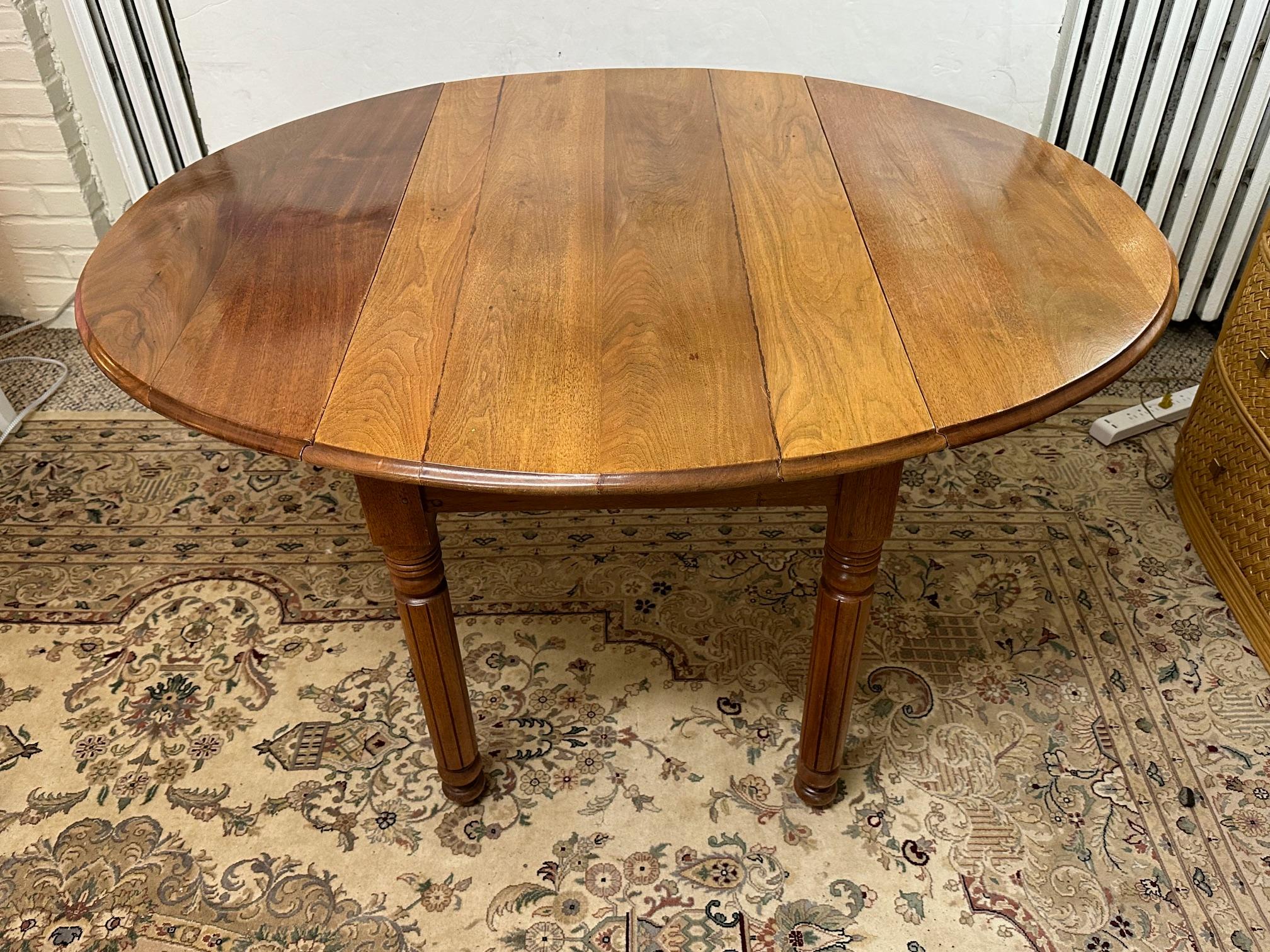 Versatile Antique Walnut Oval Drop Leaf Dining Table  For Sale 3