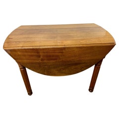 Versatile Antique Walnut Oval Drop Leaf Dining Table 