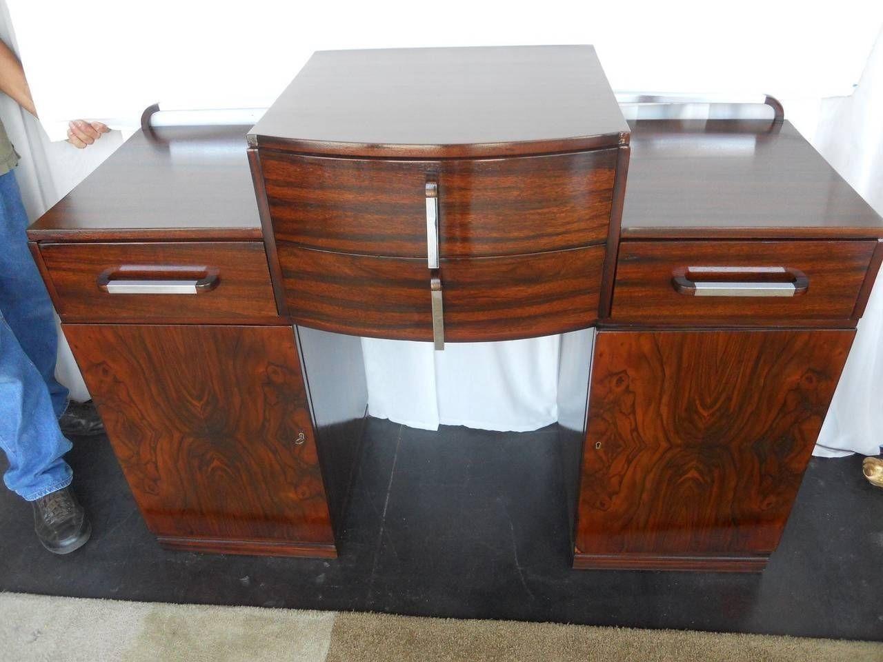 Versatile Art Deco console or commode with drawers.
 
Made of African burl walnut and African mahogany.