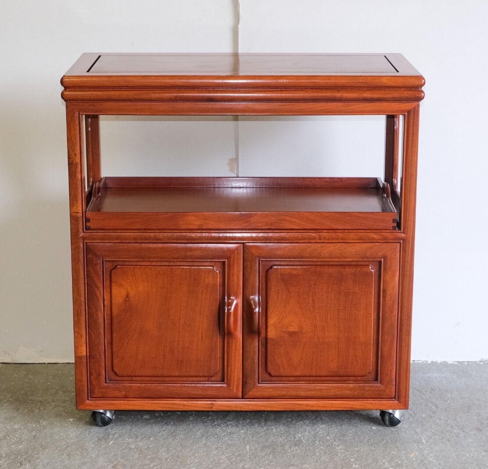 We are delighted to offer for sale this lovely rosewood Chinese buffet sideboard with tray, single tier, and cupboard.

This versatile, unique and well made piece compromises a good size tray and cupboard. The top can be open and slide, so it can be