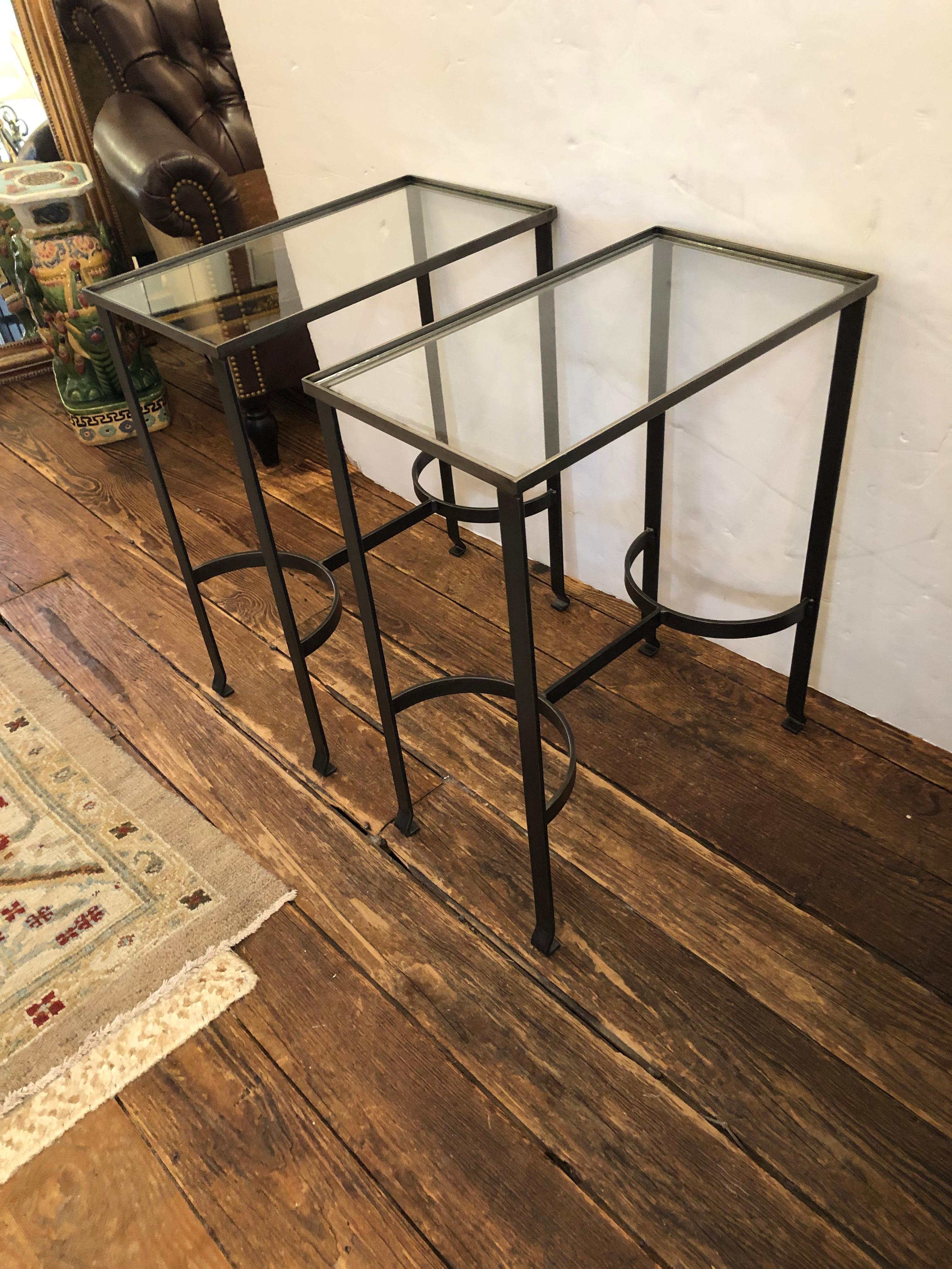 Streamlined modern gunmetal steel and glass top rectangular pair of end tables in a compact elegant size.