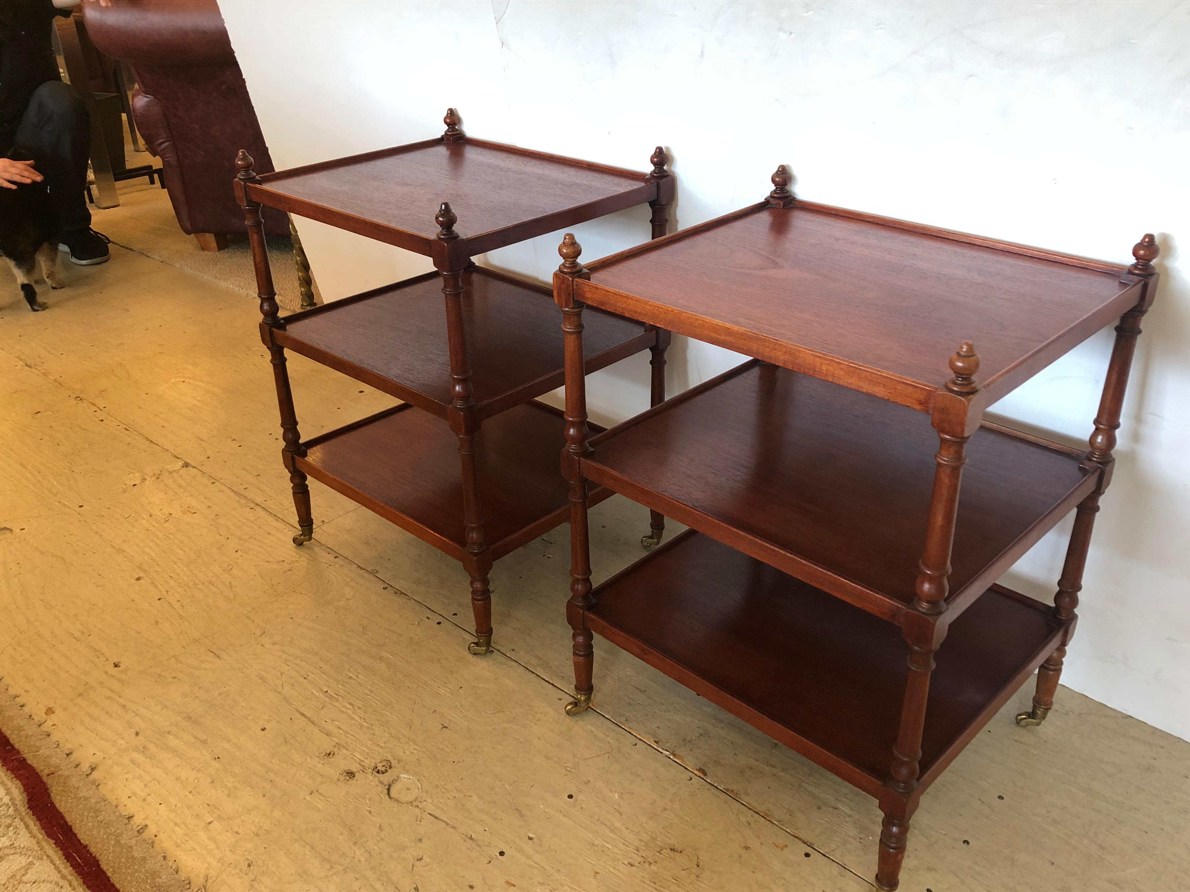 A great looking well-made pair of 3-tier solid mahogany end or side tables having turned legs and finials as well as original brass casters. They can be placed in wide or narrow direction, equally beautiful depending on space allowances.
Measures: