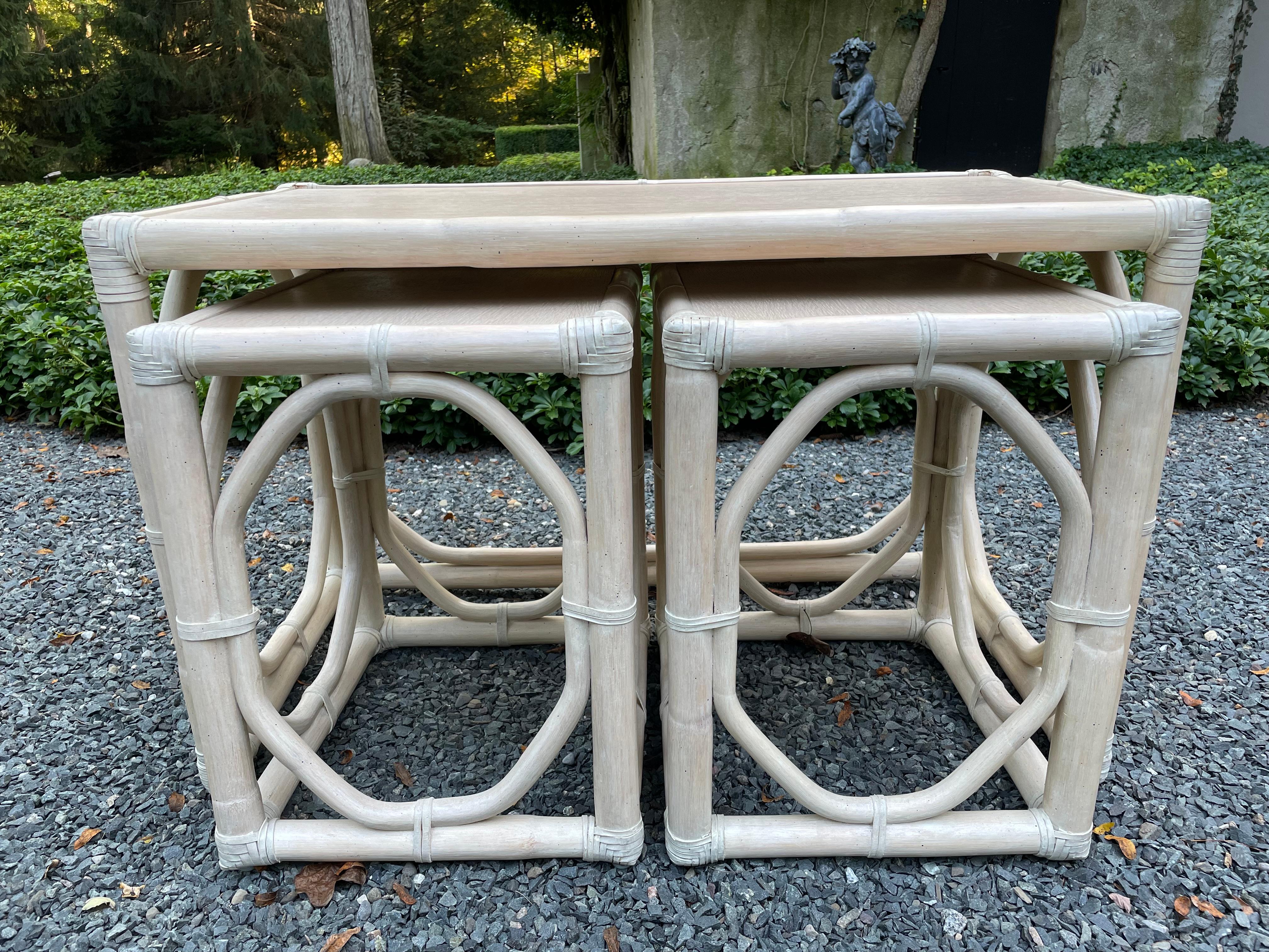 This a set of three nesting tables in cerused wood by McGuire. The largest table is a coffee table (measurements provided below) and the two tables that tuck underneath measure 18.5” tall x 16” wide x 14” deep. This design is a great way of having