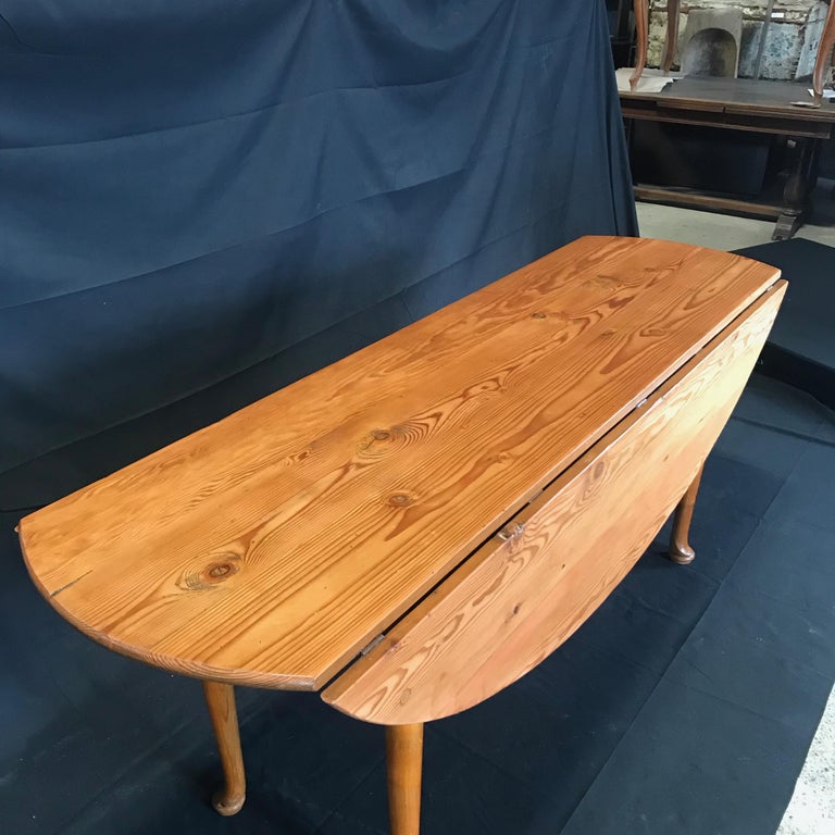 Versatile Turn of the Century Irish Pine Oval Dropleaf Dining Table at