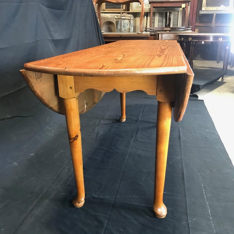 Versatile Turn of the Century Irish Pine Oval Dropleaf Dining Table at