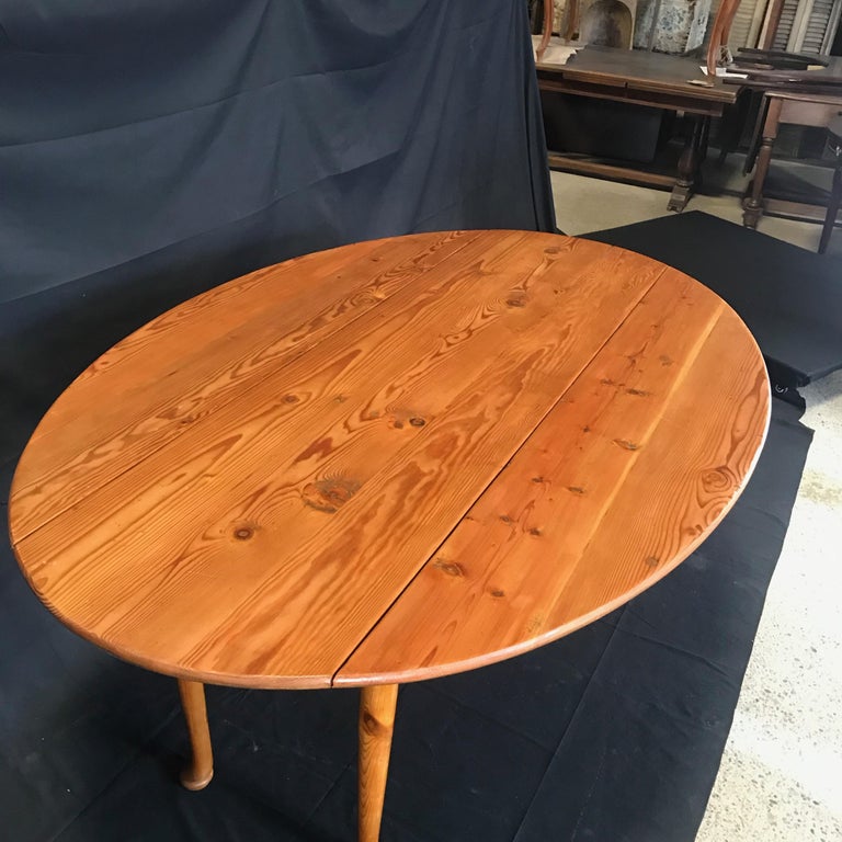 Versatile Turn of the Century Irish Pine Oval Dropleaf Dining Table at