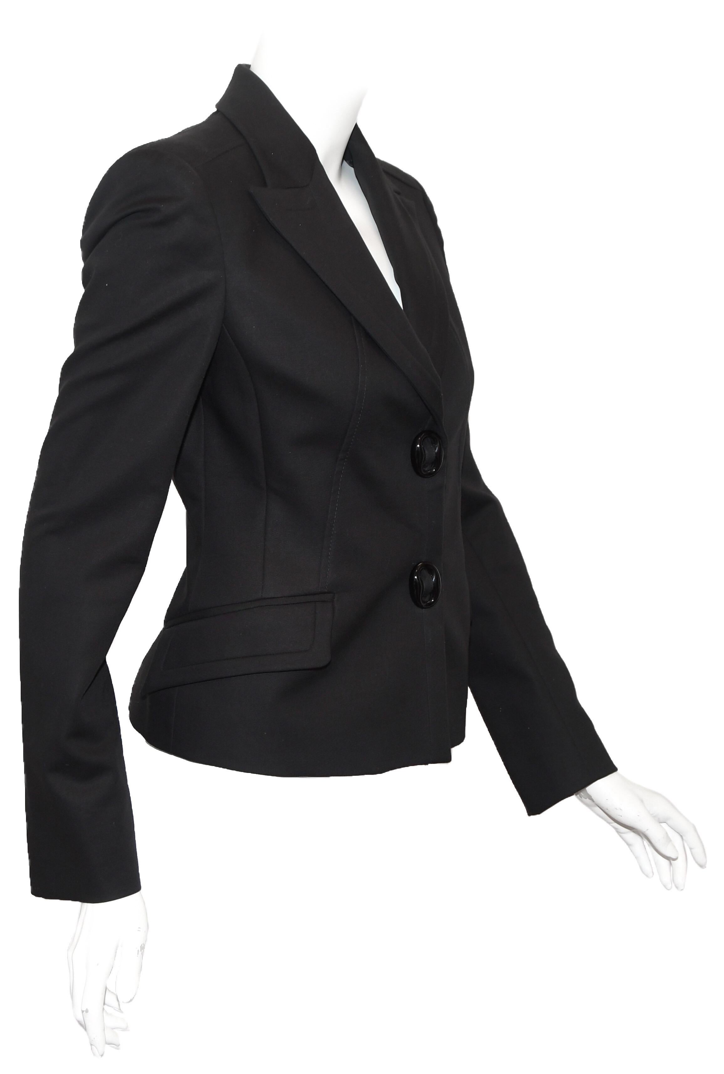Versace black jacket features fitted silhouette, notched collar, and two flap pockets,  and 2 oval Versace buttons.  This cotton blend blazer is lined in black viscose.  Exquisite Italian workmanship abounds!  Excellent Condition.  Made in Italy 
