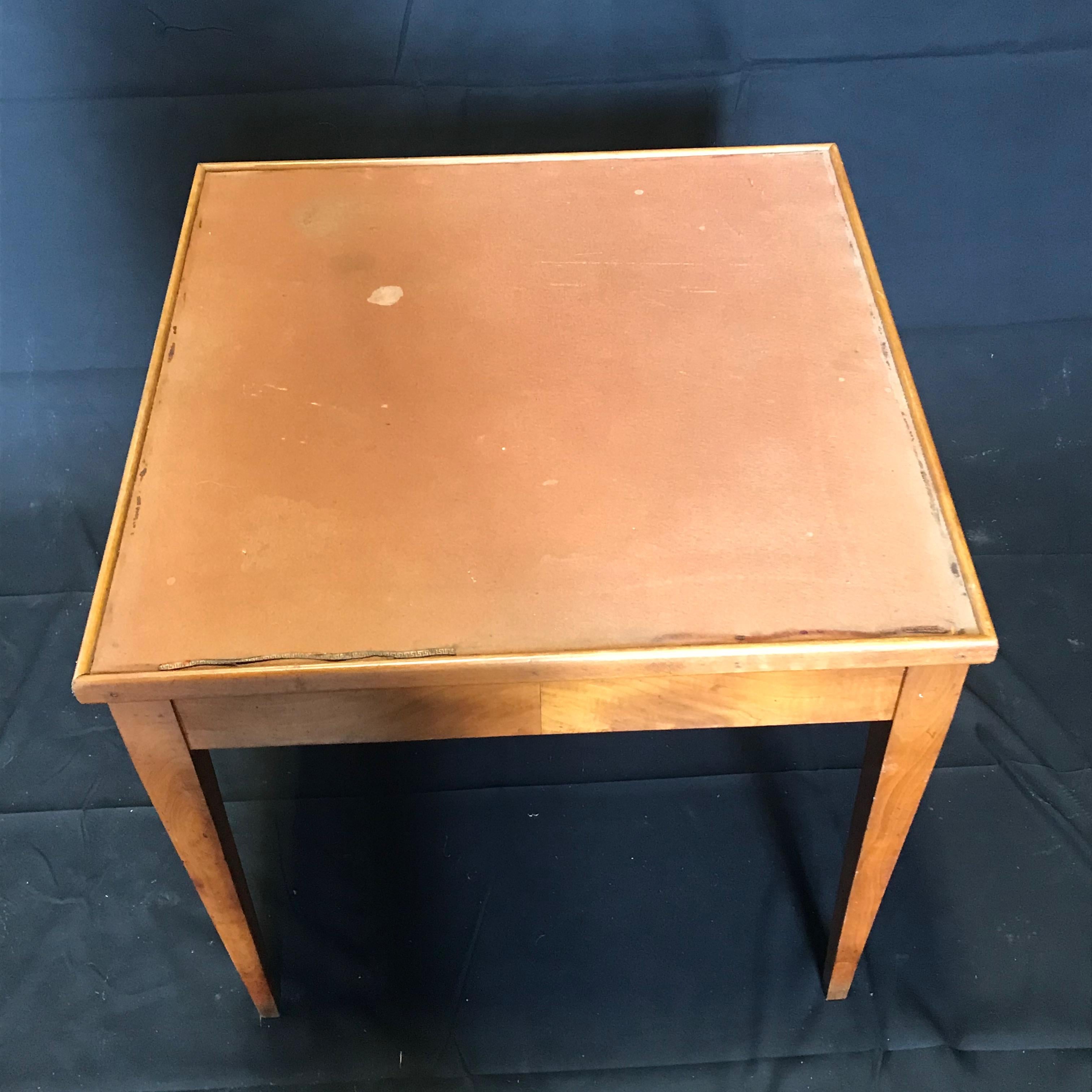 Inlaid walnut vintage game table from Chartres France, having reversible removable top for cards, checkers, chess, & backgammon. Great as a side table or central game table. Elegant tapered legs. Game pieces included. Measures: To apron 21.25.
#5698